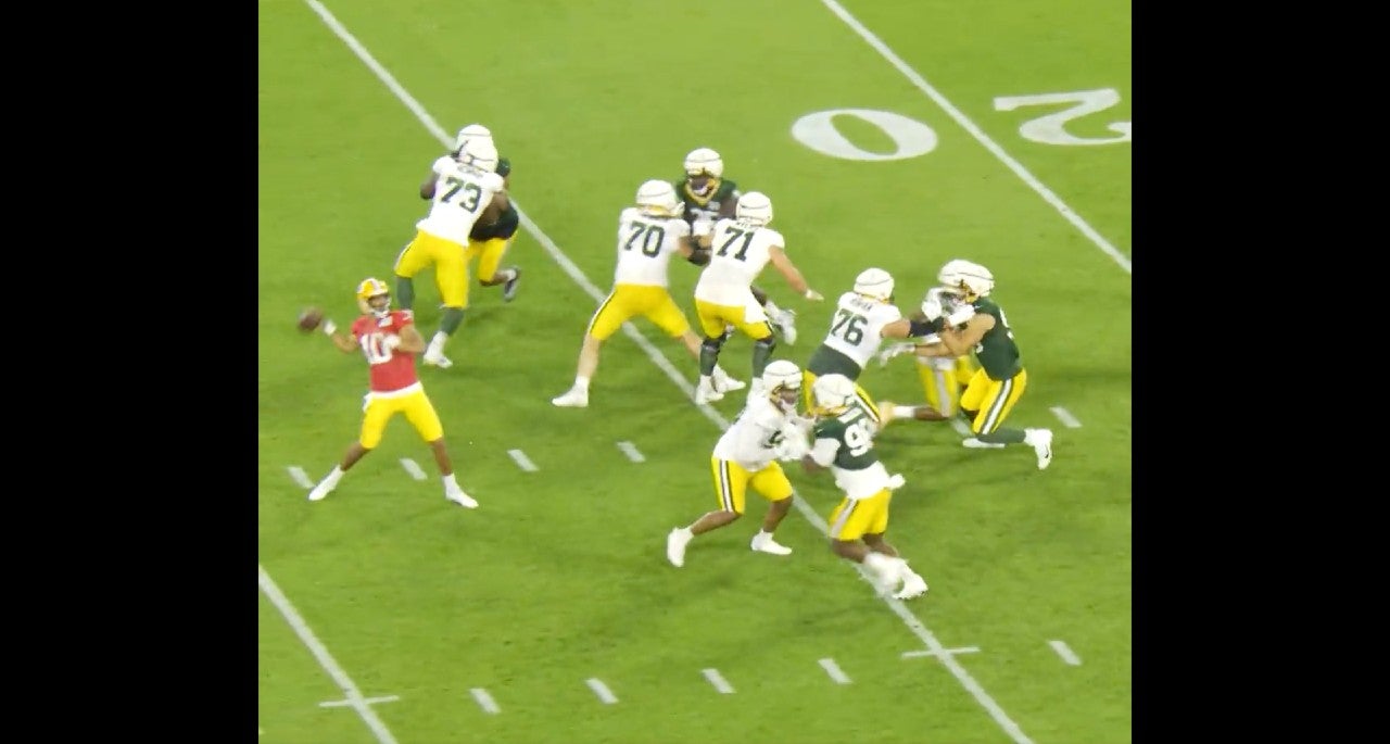 Jordan Love drops back to pass on Packers Family Night.