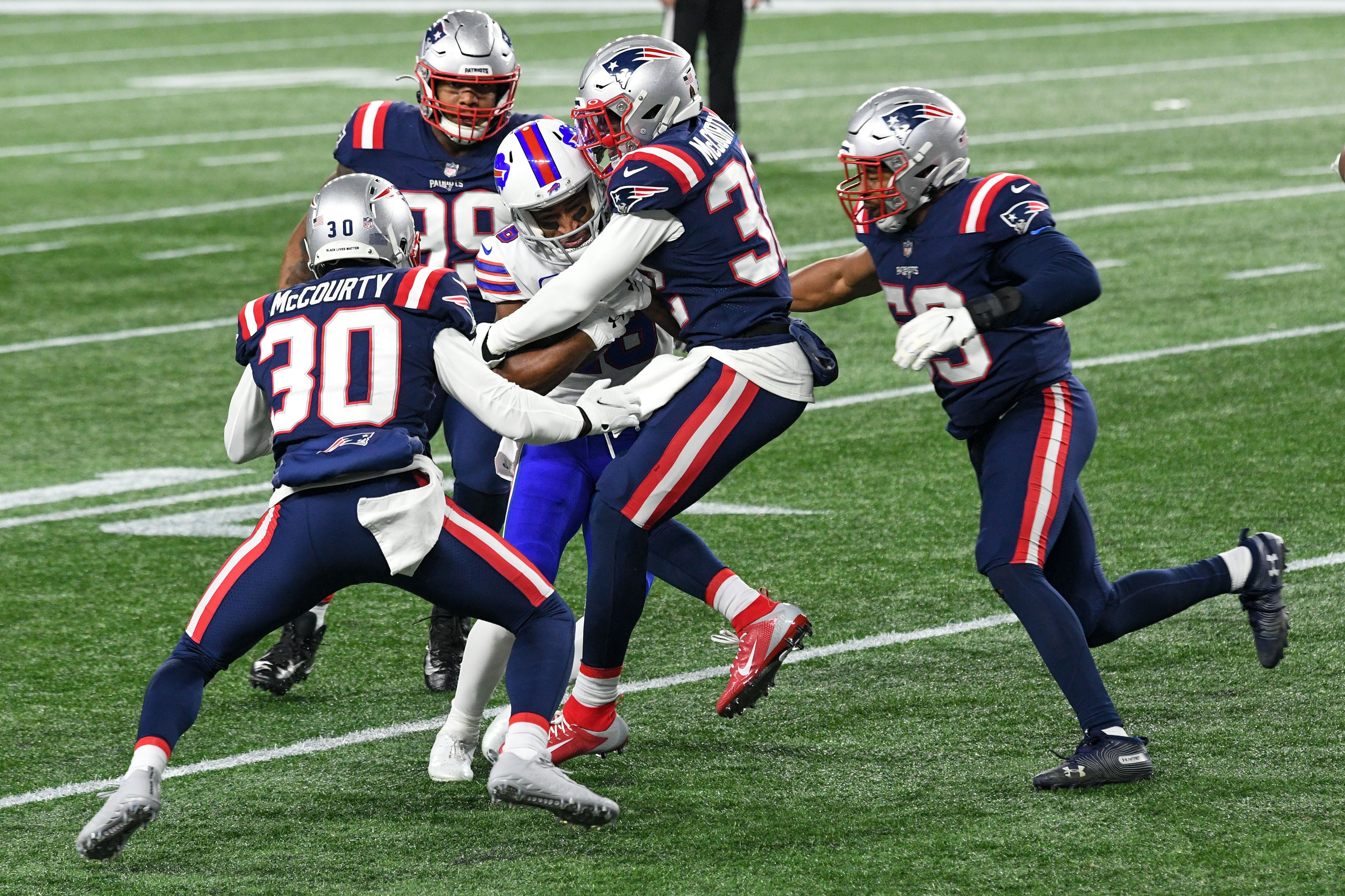 New England Patriots' Jason and Devin McCourty making the play vs Buffalo Bills