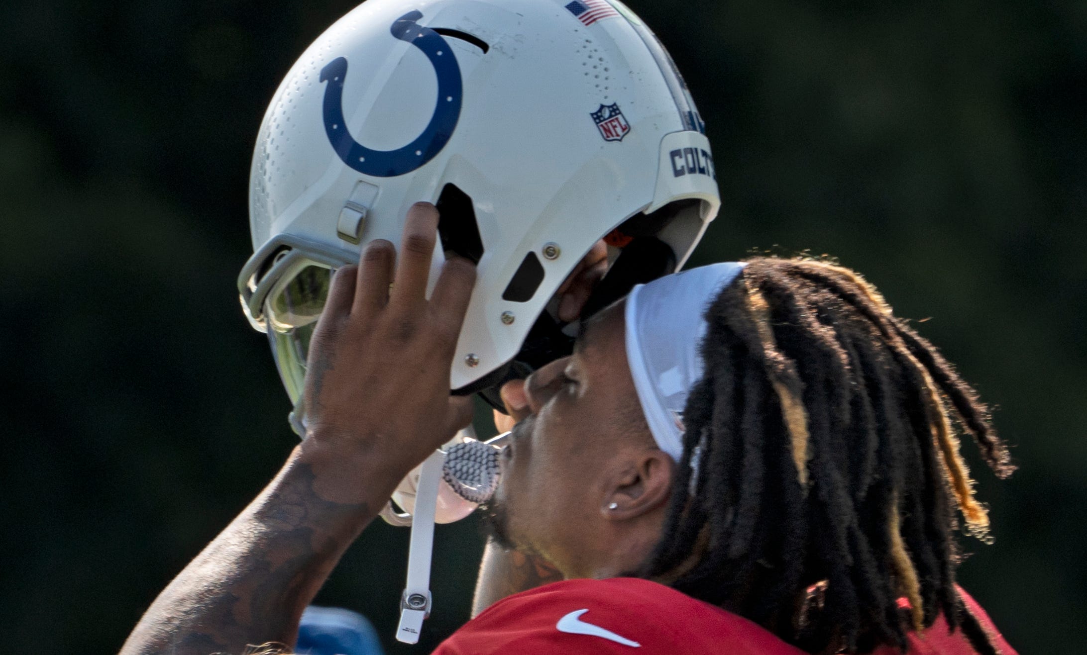 Indianapolis Colts quarterback Anthony Richardson (5) puts on his helmet during Colts Camp practice at Grand Park, Tuesday, Aug. 1, 2023 in Westfield.