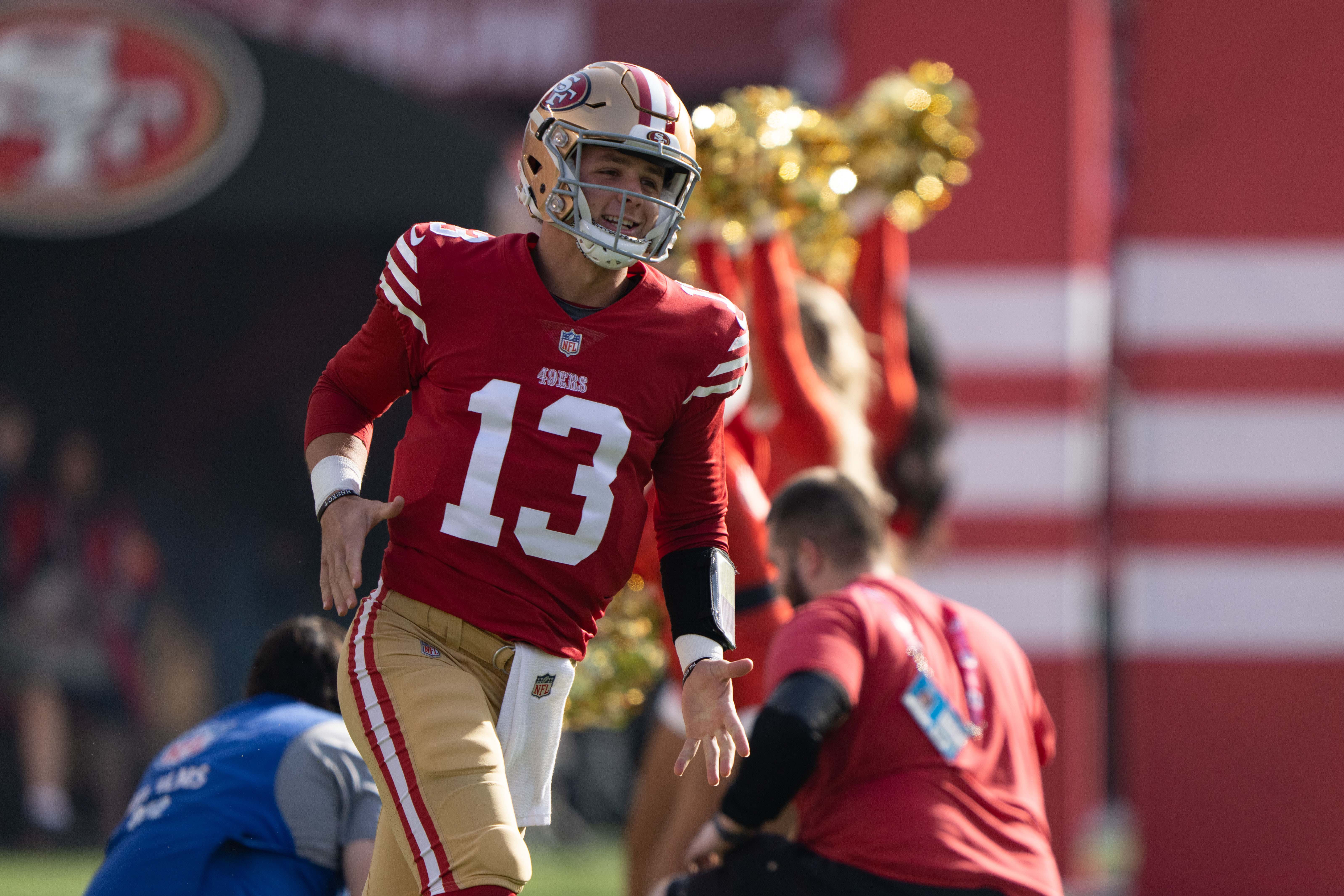 Dec 24, 2022; Santa Clara, California, USA; San Francisco 49ers quarterback Brock Purdy (13) runs onto the field before the start of the first quarter against the Washington Commanders at Levi's Stadium. Mandatory Credit: Stan Szeto-USA TODAY Sports