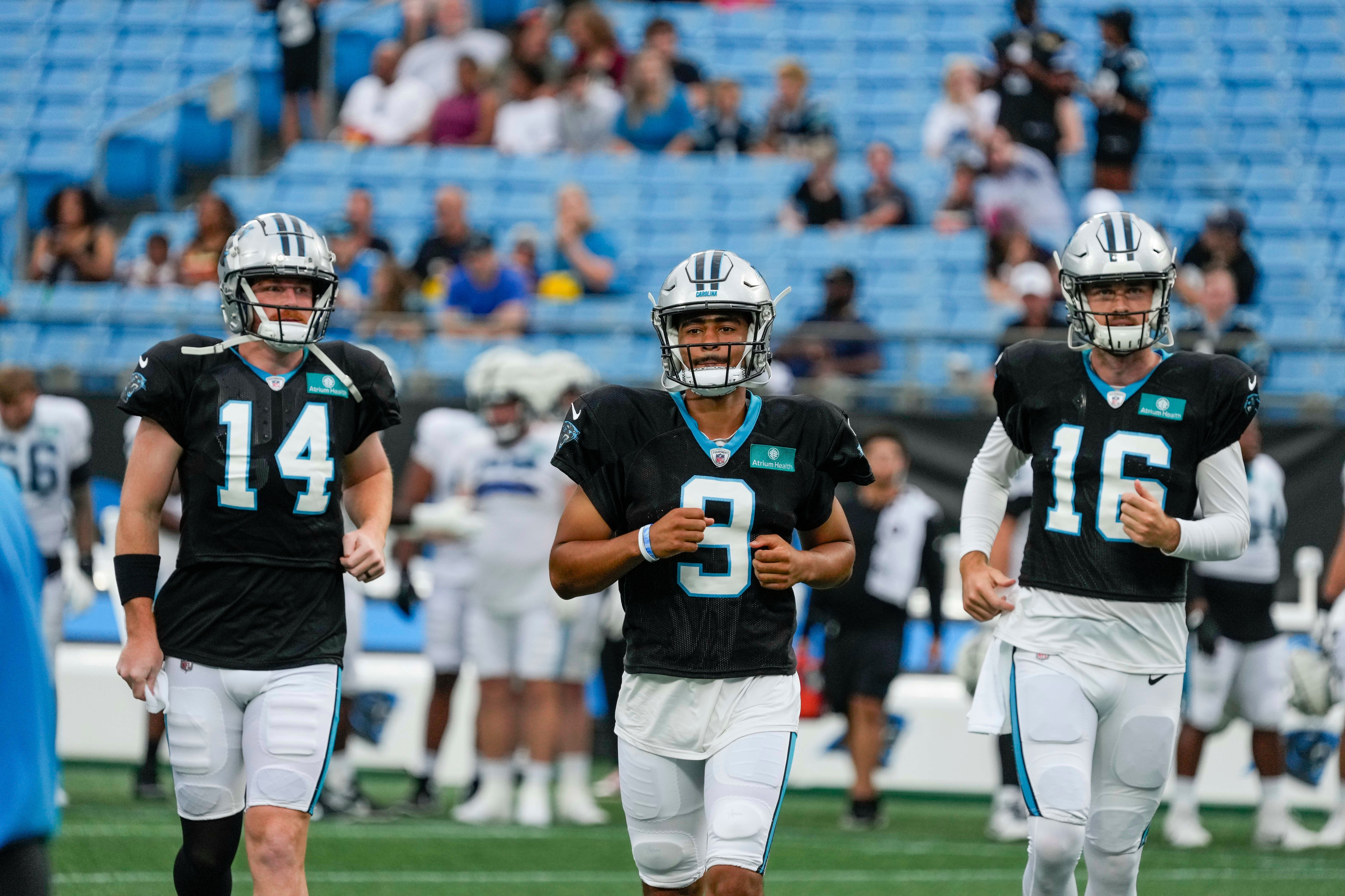 Aug 2, 2023; Charlotte, NC, USA; quarterback Andy Dalton (14), Bryce Young and Jake Luton (16) during Carolina Panthers Fan Fest at Bank of America Stadium in Charlotte, NC.