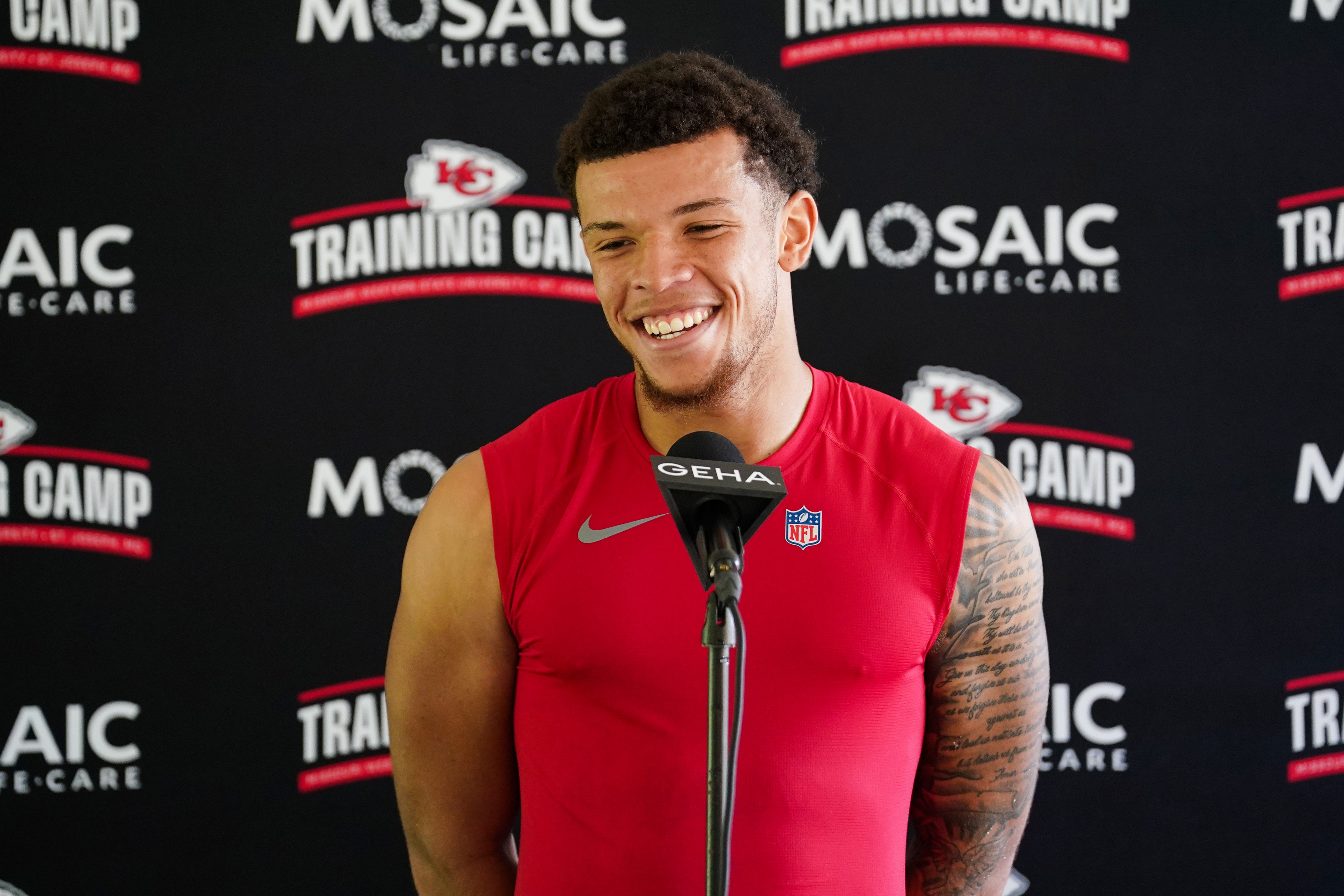 kansas city chiefs receiver skyy moore smiling at training camp