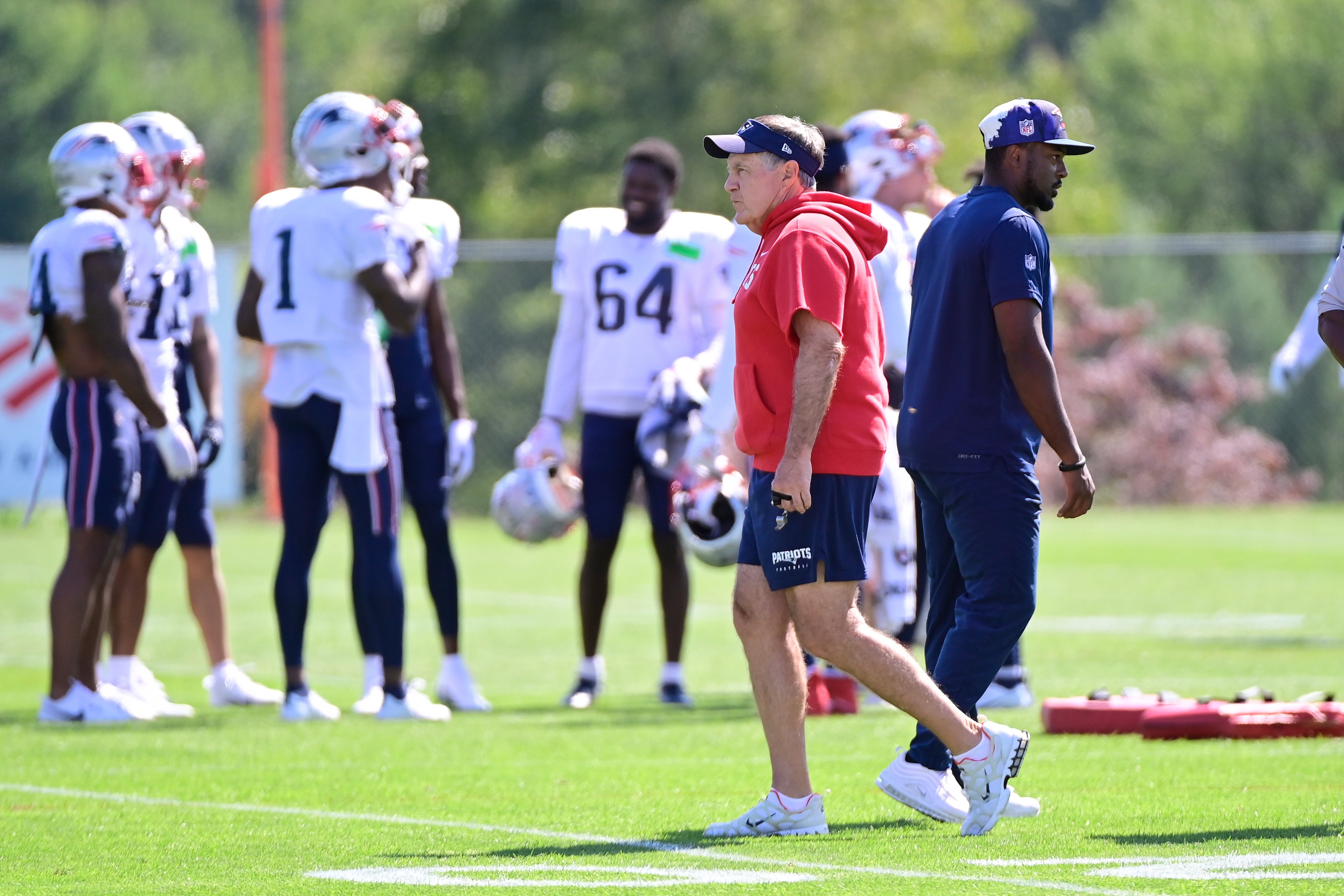 Aug 1, 2023; Foxborough, MA, USA; New England Patriots head coach Bill Belichick watches the team during training camp at Gillette Stadium