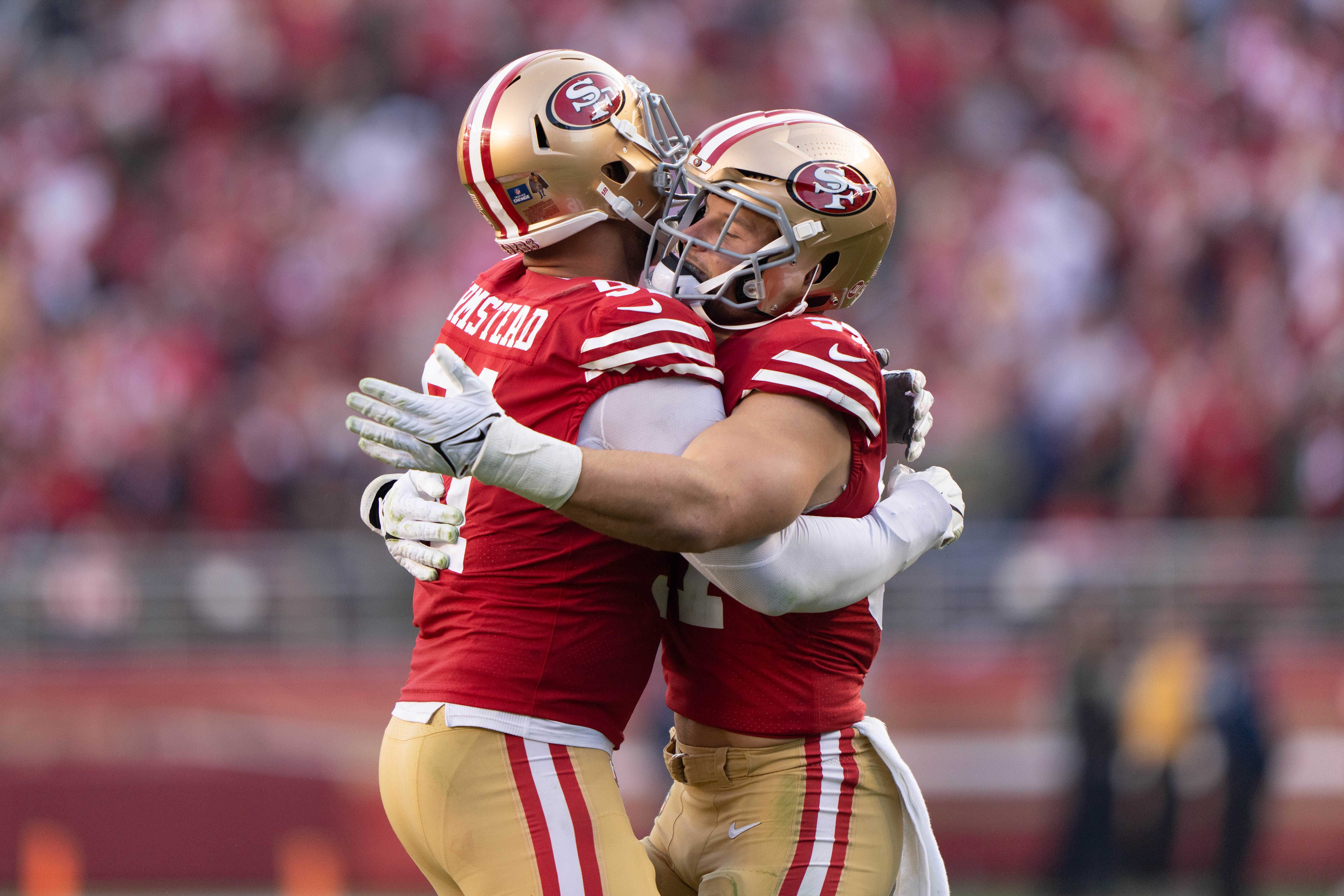 Dec 24, 2022; Santa Clara, California, USA; San Francisco 49ers defensive end Arik Armstead (91) and defensive end Nick Bosa (97) celebrate during the fourth quarter against the Washington Commanders at Levi's Stadium. Mandatory Credit: Stan Szeto-USA TODAY Sports
