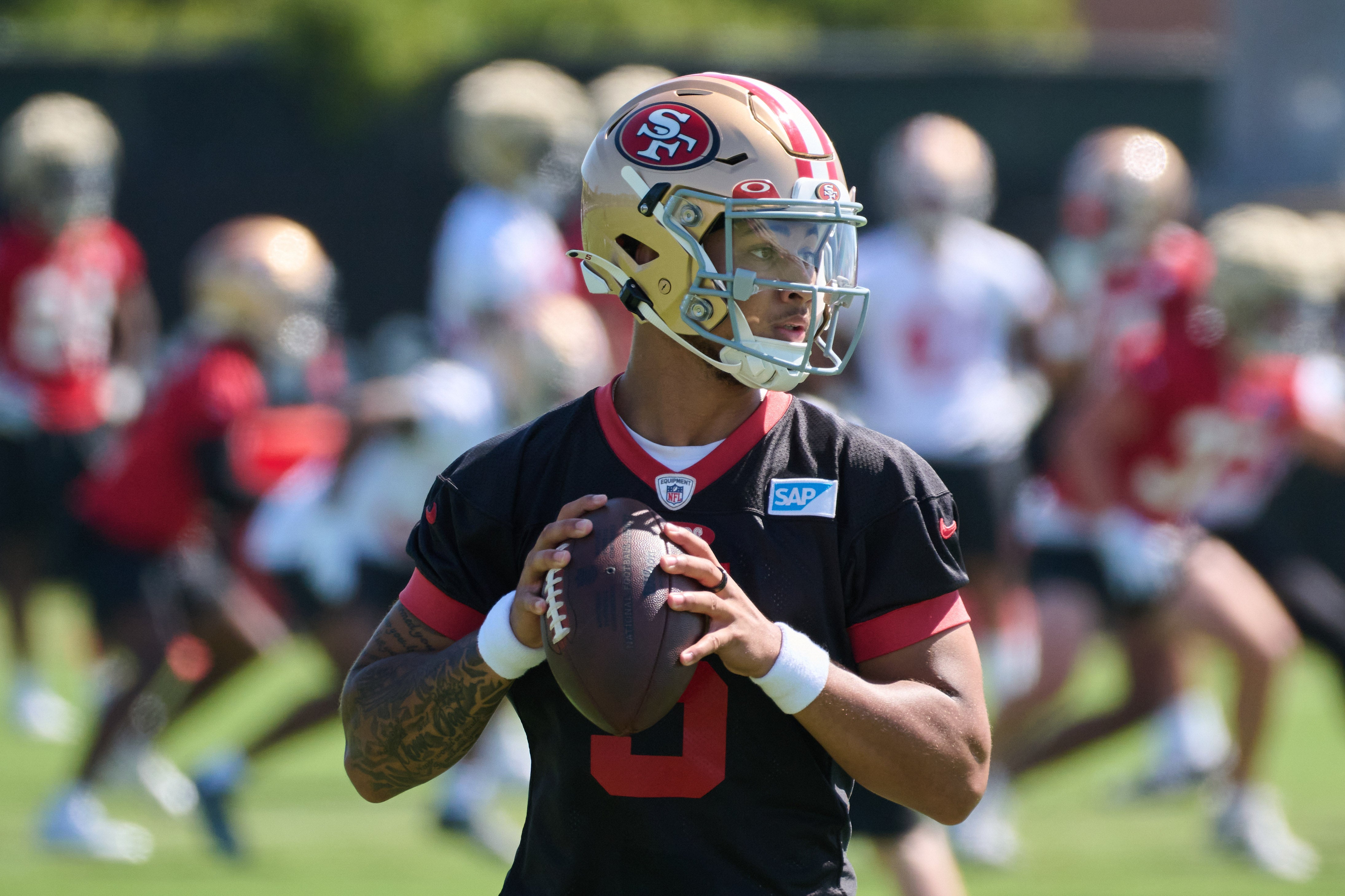 Jul 27, 2023; Santa Clara, CA, USA; San Francisco 49ers quarterback Trey Lance (5) drops back to throw a pass during training camp at the SAP Performance Facility. Mandatory Credit: Robert Edwards-USA TODAY Sports