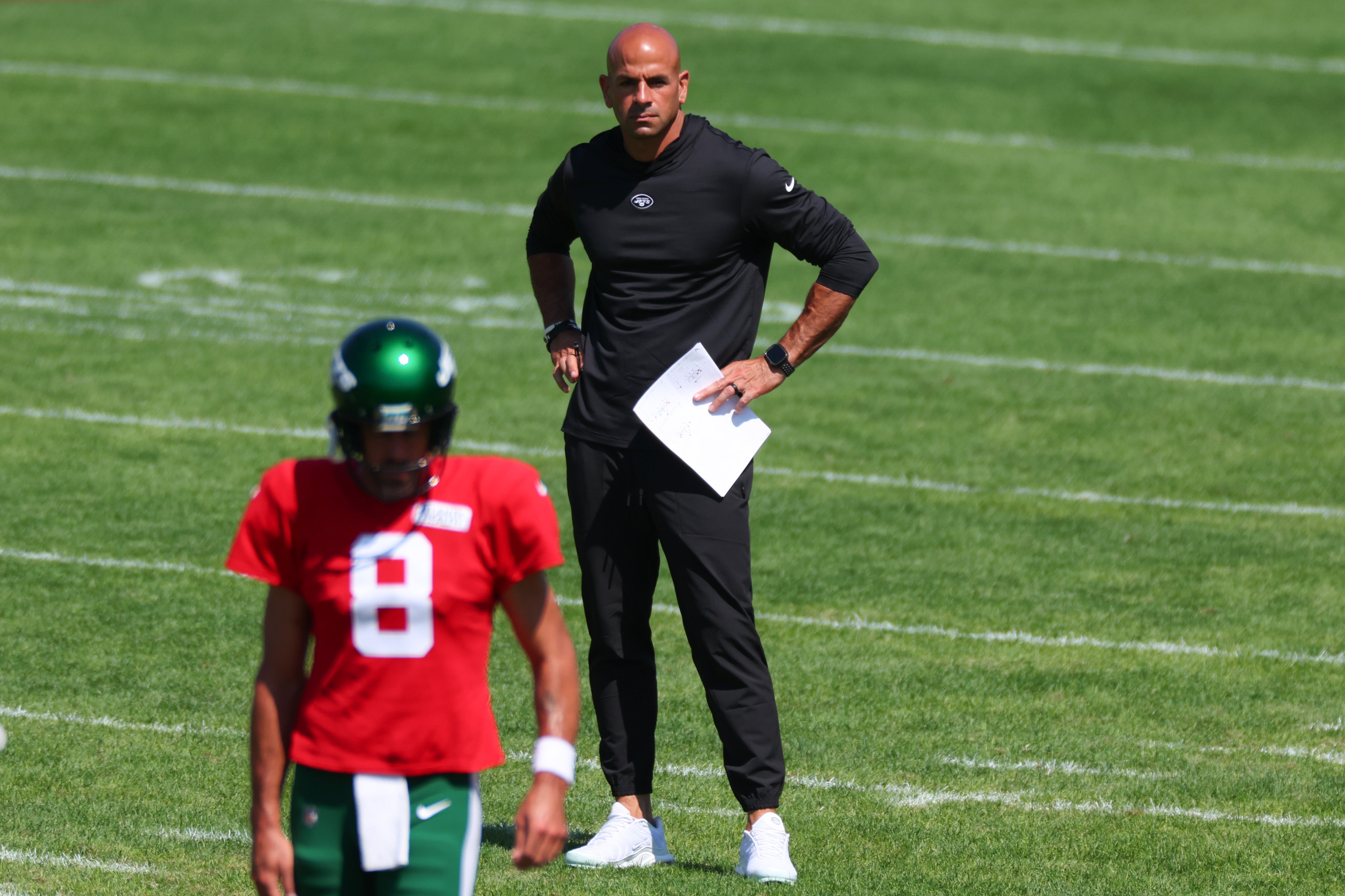 New York Jets head coach Robert Saleh looks on behind quarterback Aaron Rodgers (8) during the New York Jets Training Camp at Atlantic Health Jets Training Center. Mandatory Credit: Vincent Carchietta-USA TODAY Sports