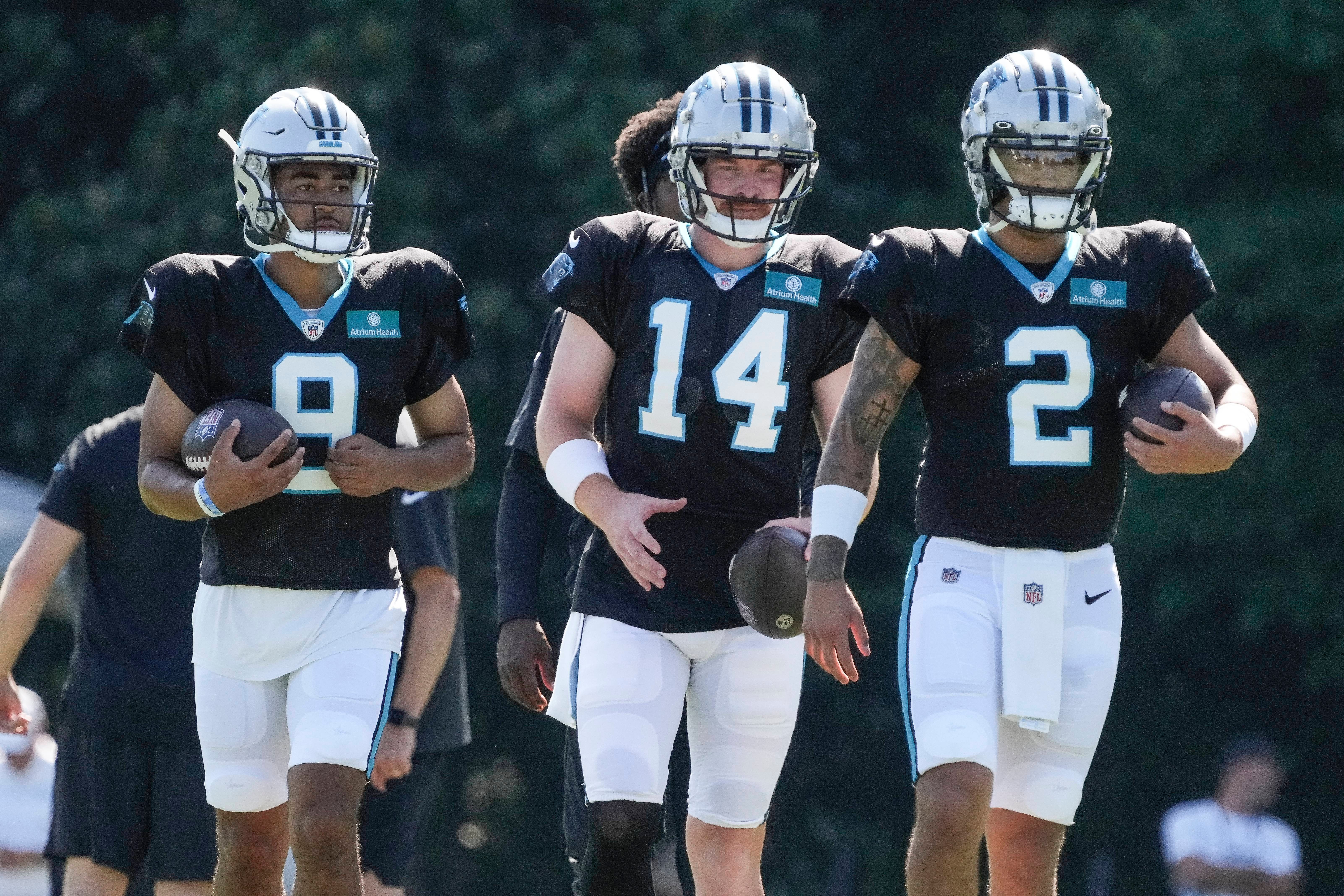 Jul 31, 2023; Spartanburg, SC, USA; Carolina Panthers quarterback Bryce Young (9), quarterback Andy Dalton (14) and quarterback Matt Corral (2) during a passing drill during training camp at Wofford College. Mandatory Credit: Jim Dedmon-USA TODAY Sports