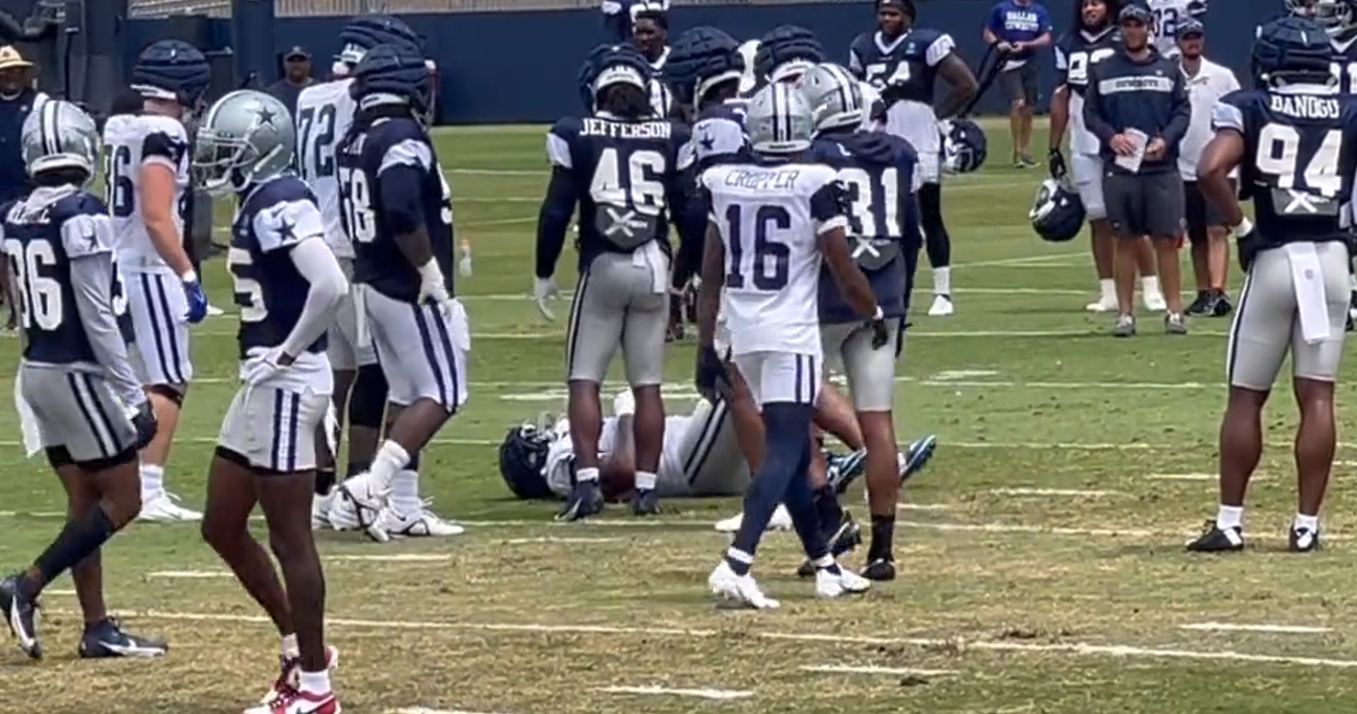 Dallas Cowboys OL Chuma Edoga is on the ground following an apparent knee injury in training camp. (Via Michael Gehlken's X)
