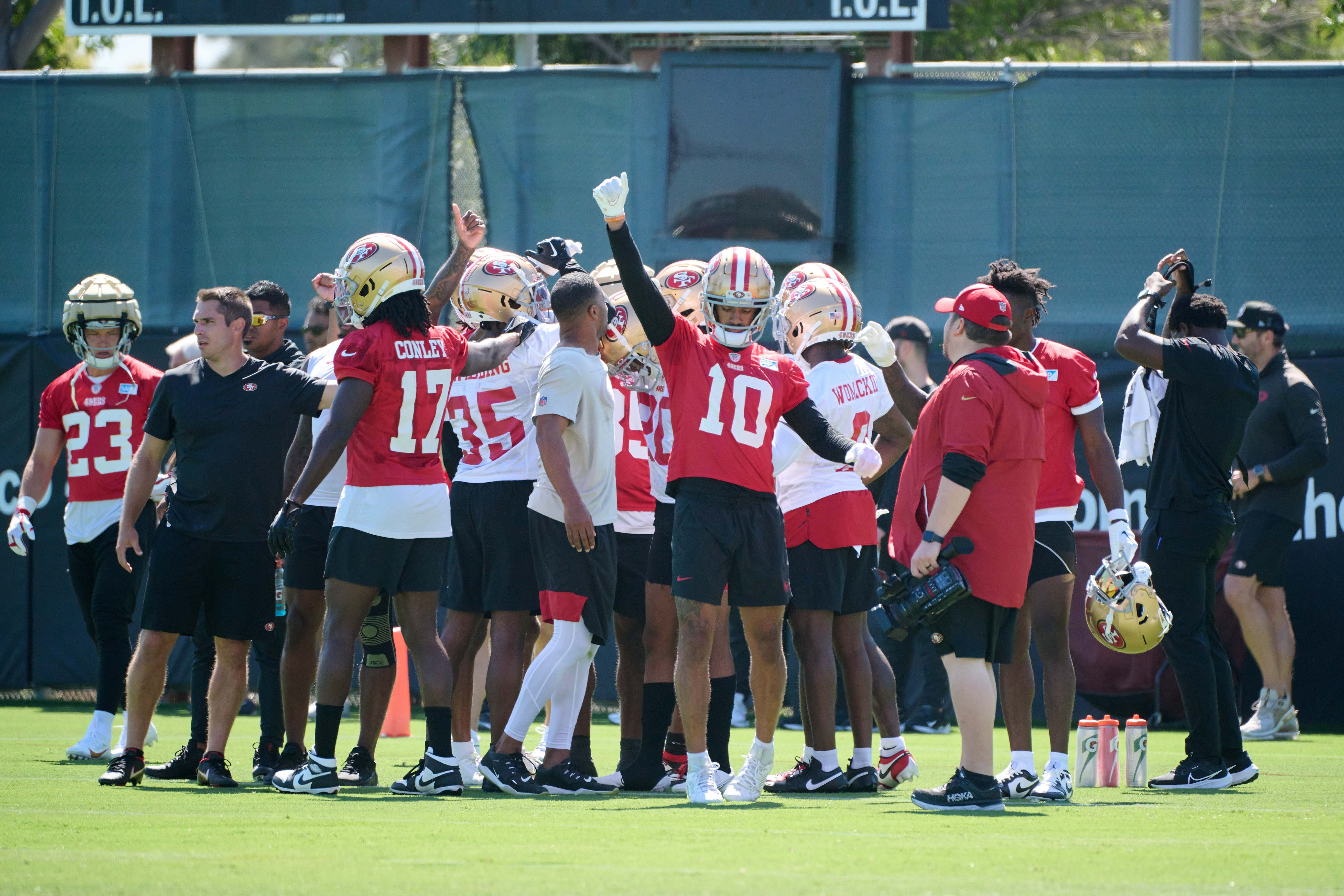 Jul 27, 2023; Santa Clara, CA, USA; San Francisco 49ers wide receiver Ronnie Bell (10) and members of the offensive squad huddle between drills during training camp at the SAP Performance Facility. Mandatory Credit: Robert Edwards-USA TODAY Sports