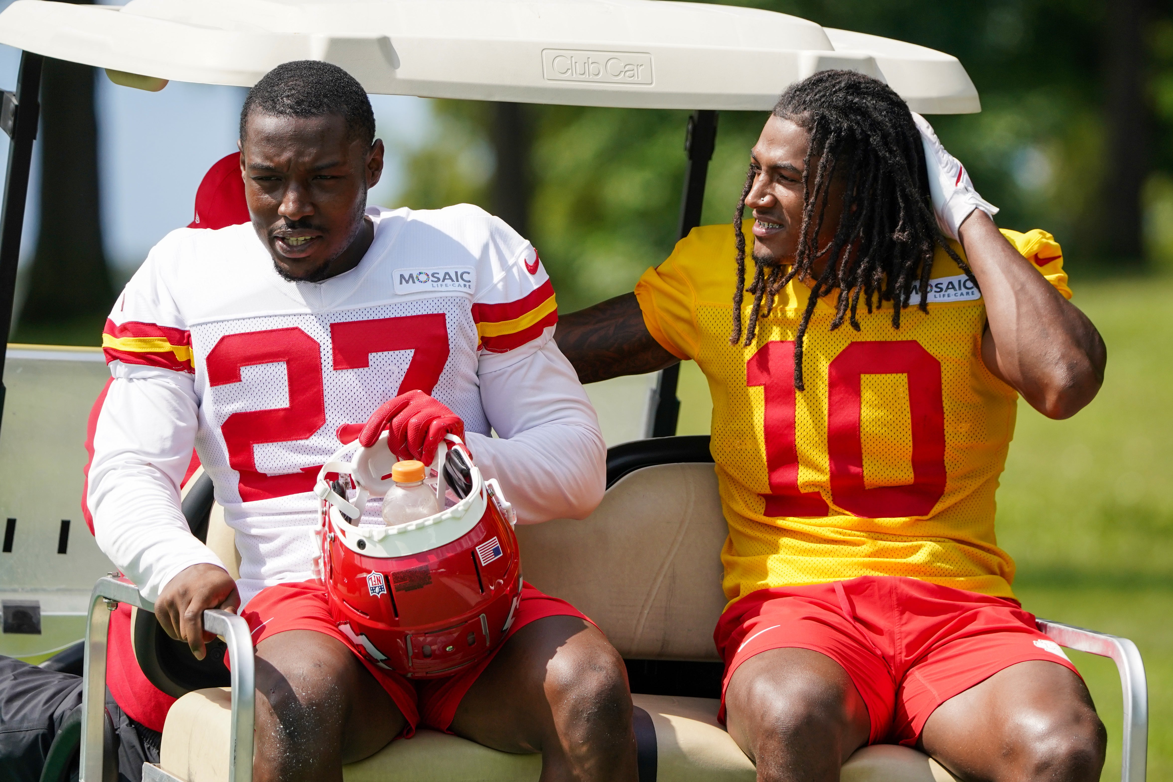 Jul 24, 2023; St. Joseph, MO, USA; Kansas City Chiefs safety Chamarri Conner (27) and running back Isiah Pacheco (10) ride a golf cart to the locker rooms during training camp at Missouri Western State University. Mandatory Credit: Denny Medley-USA TODAY Sports