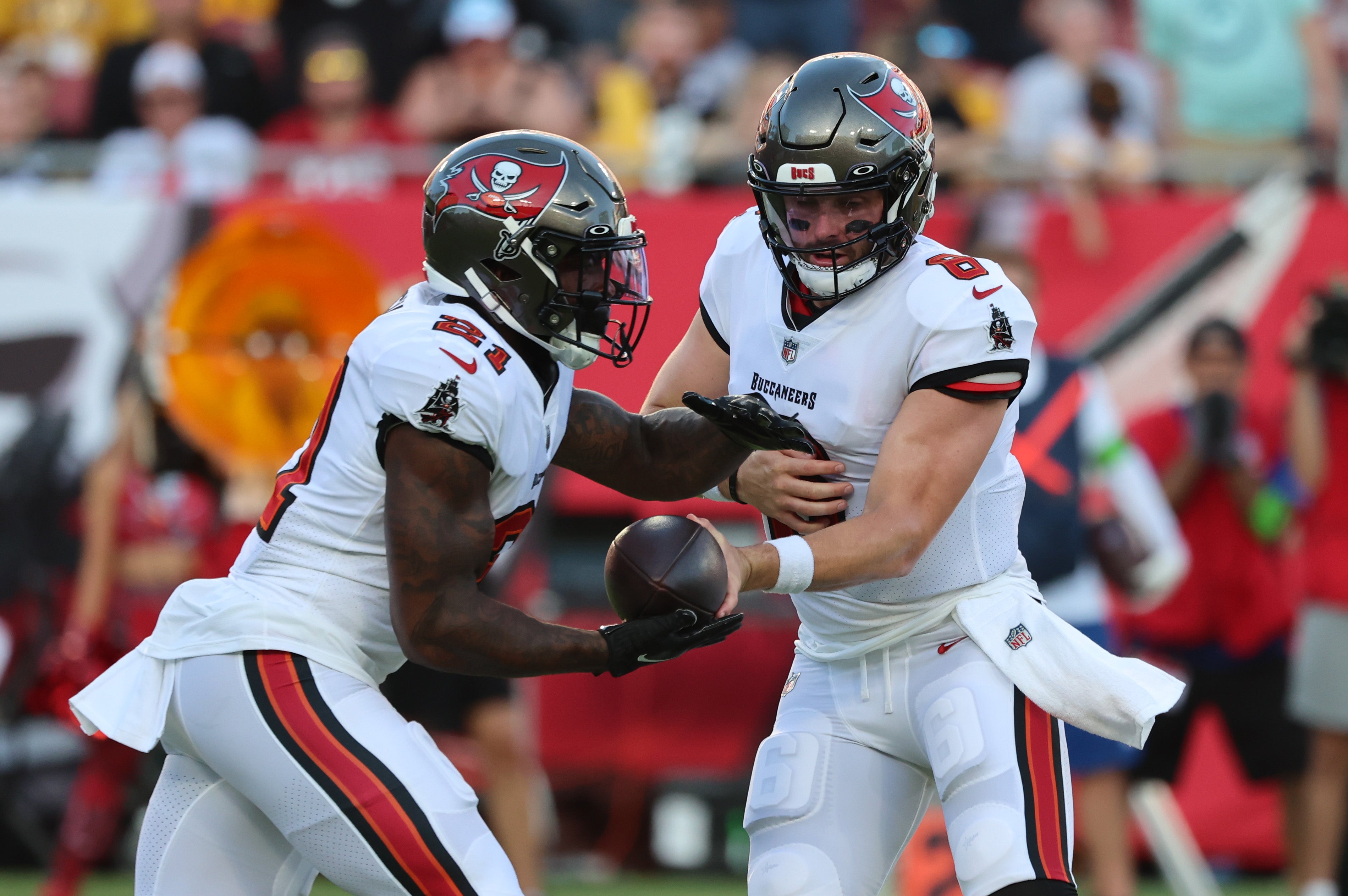 Aug 11, 2023; Tampa, Florida, USA; Tampa Bay Buccaneers quarterback Baker Mayfield (6) hands off to running back Ke'Shawn Vaughn (21) against the Pittsburgh Steelers during the first quarter at Raymond James Stadium. Mandatory Credit: Kim Klement Neitzel-USA TODAY Sports