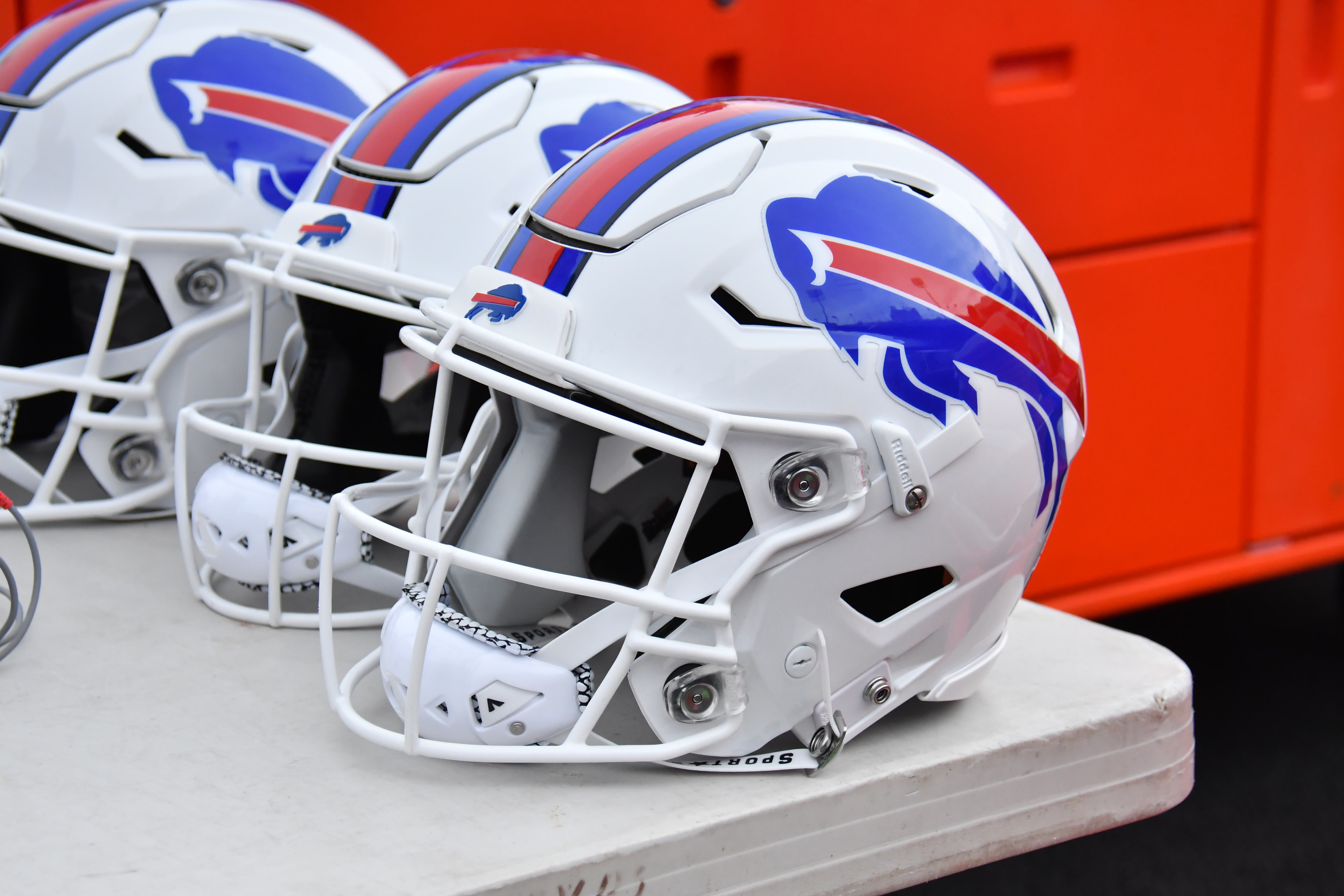 Aug 12, 2023; Orchard Park, New York, USA; Buffalo Bills helmets are seen behind the bench before a preseason game against the Indianapolis Colts at Highmark Stadium.
