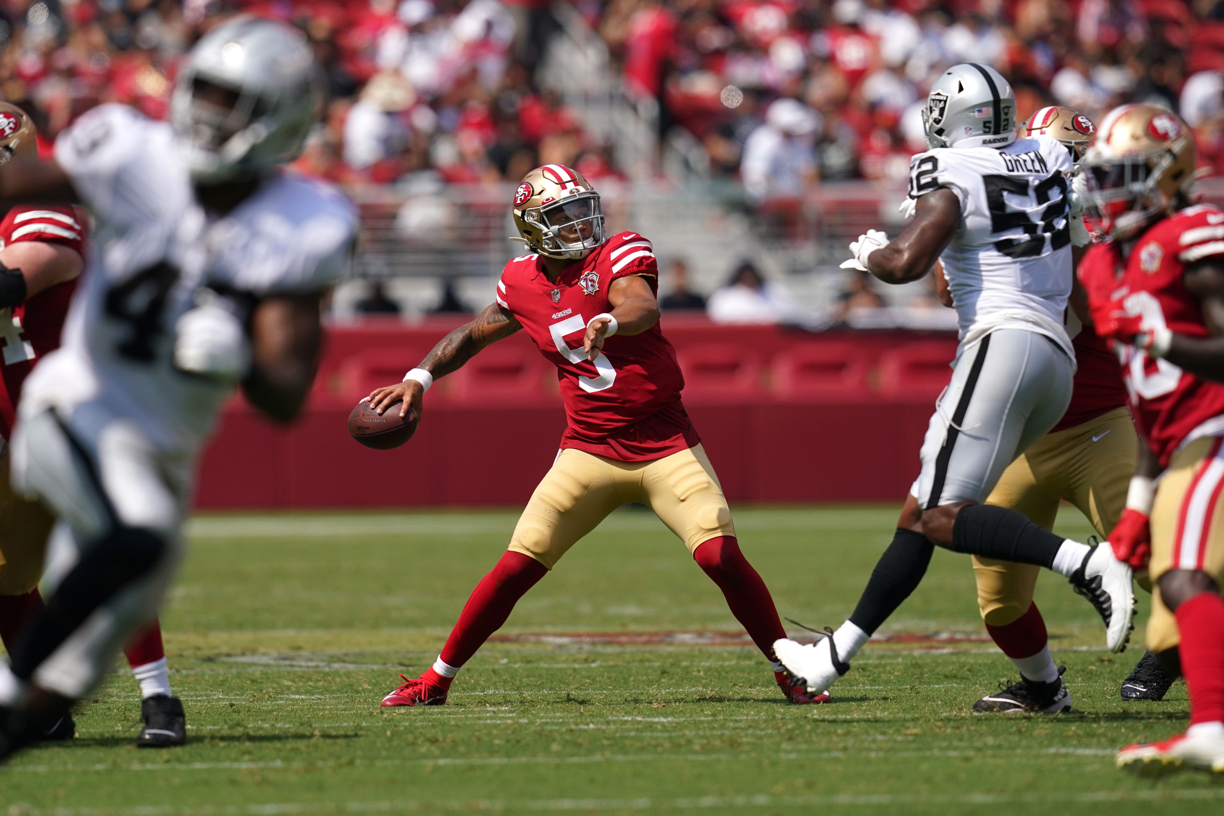 Aug 29, 2021; Santa Clara, California, USA; San Francisco 49ers quarterback Trey Lance (5) throws a pass against the Las Vegas Raiders in the second quarter at Levi's Stadium. Mandatory Credit: Cary Edmondson-USA TODAY Sports