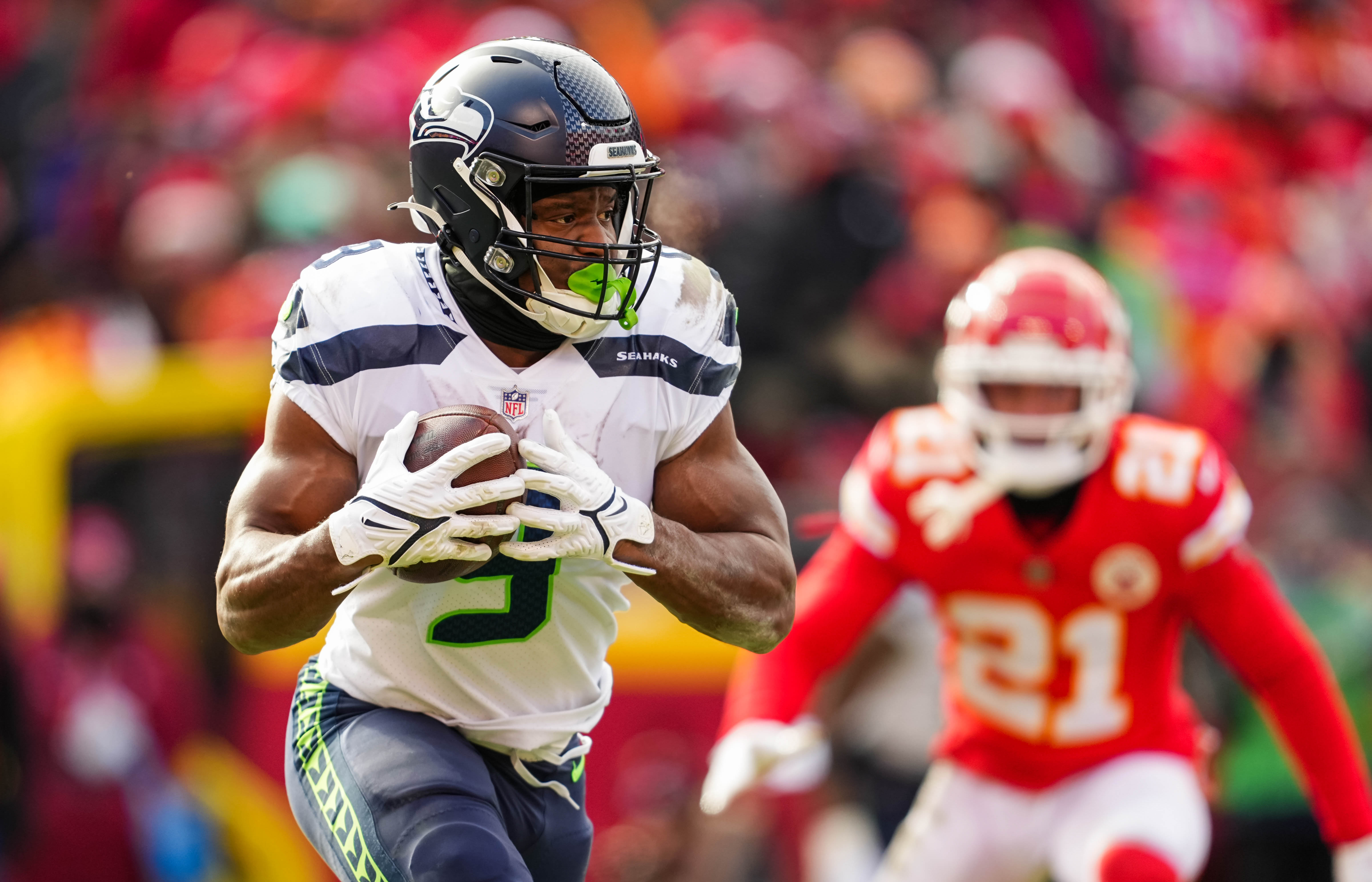 Dec 24, 2022; Kansas City, Missouri, USA; Seattle Seahawks running back Kenneth Walker III (9) runs the ball during the second half against the Kansas City Chiefs at GEHA Field at Arrowhead Stadium. Mandatory Credit: Jay Biggerstaff-USA TODAY Sports