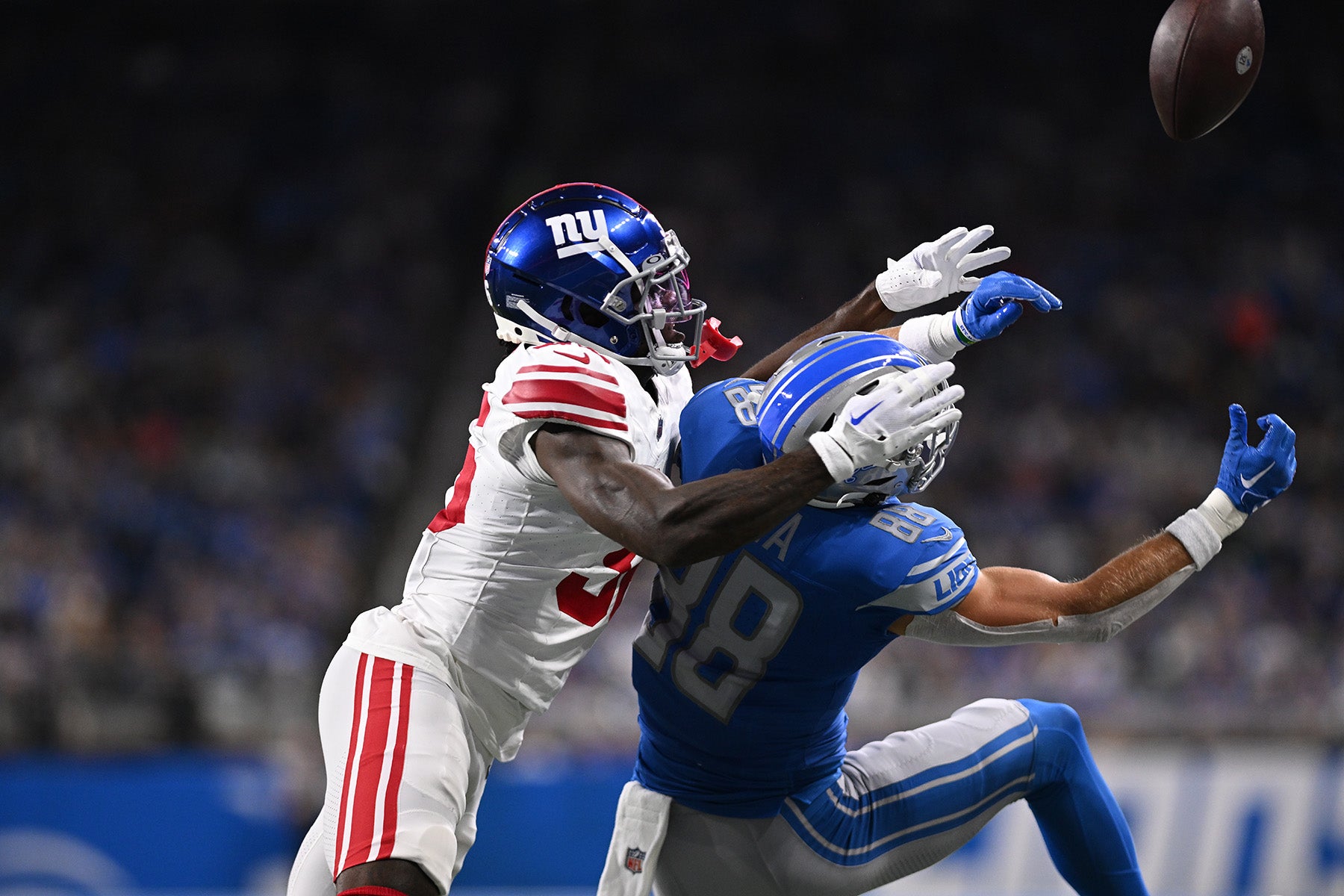 Aug 11, 2023; Detroit, Michigan, USA; New York Giants cornerback Deonte Banks (36) breaks up a pass intended for Detroit Lions wide receiver Chase Cota (88) in the first quarter at Ford Field. Mandatory Credit: Lon Horwedel-USA TODAY Sports
