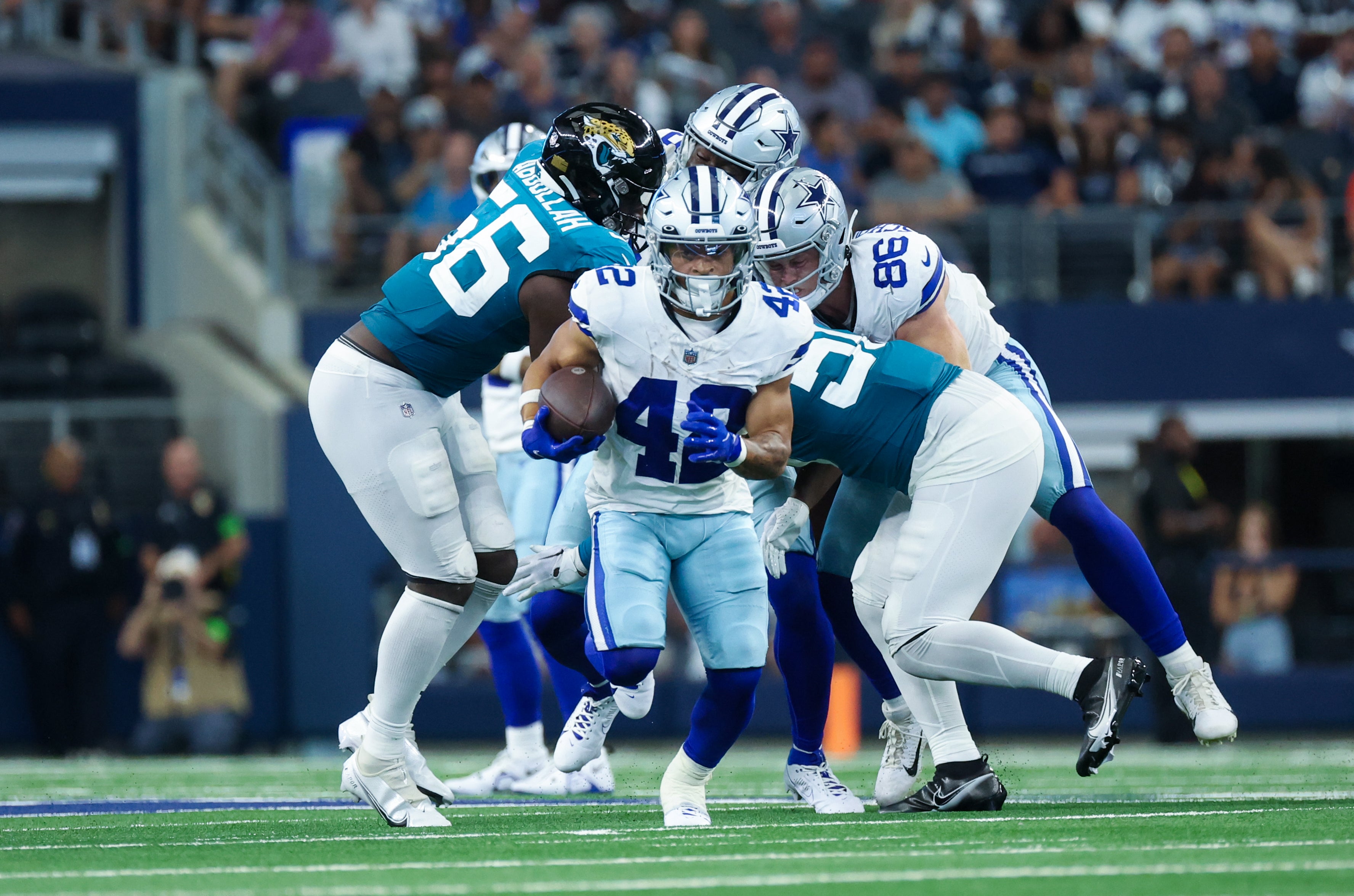 Dallas Cowboys running back Deuce Vaughn (42) runs for yardage during the second half against the Jacksonville Jaguars at AT&T Stadium. Mandatory Credit: Kevin Jairaj-USA TODAY Sports