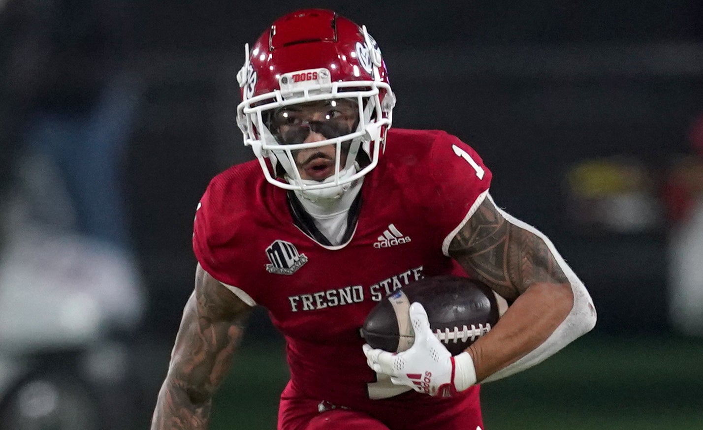 Nov 25, 2022; Fresno, California, USA; Fresno State Bulldogs wide receiver Nikko Remigio (1) runs with the ball after making a catch against the Wyoming Cowboys in the third quarter at Valley Children's Stadium. Mandatory Credit: Cary Edmondson-USA TODAY Sports