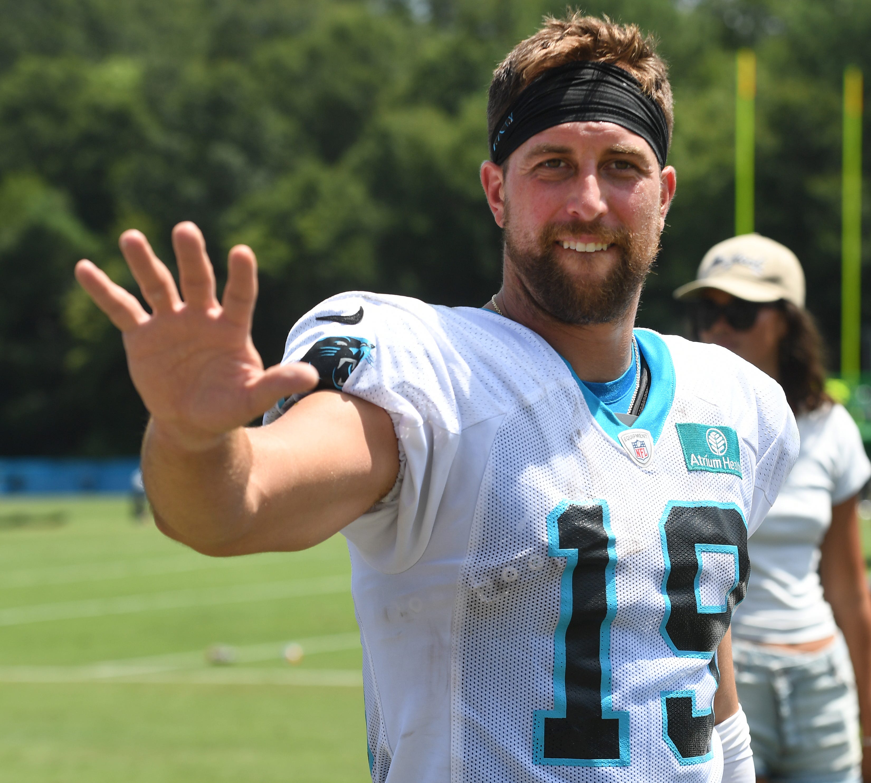 The Carolina Panthers and the New York Jets held a joint training camp practice at Wofford in Spartanburg on Aug. 9, 2023. Adam Thielen (19) of the Carolina Panthers waves to fans.