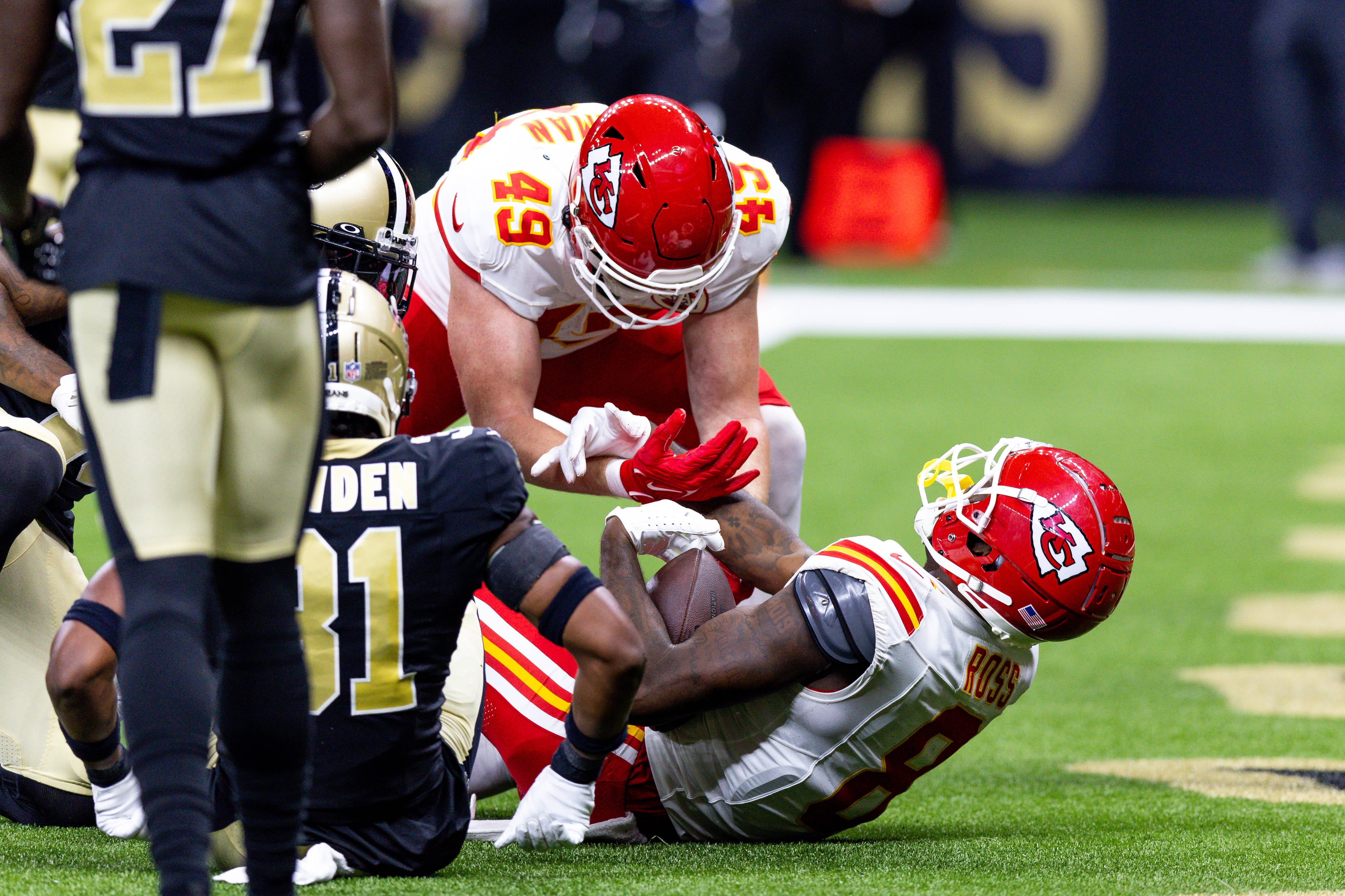 Aug 13, 2023; New Orleans, Louisiana, USA; Kansas City Chiefs wide receiver Justyn Ross (8) scores a touchdown against New Orleans Saints safety Jordan Howden (31) during the second half at the Caesars Superdome. Mandatory Credit: Stephen Lew-USA TODAY Sports