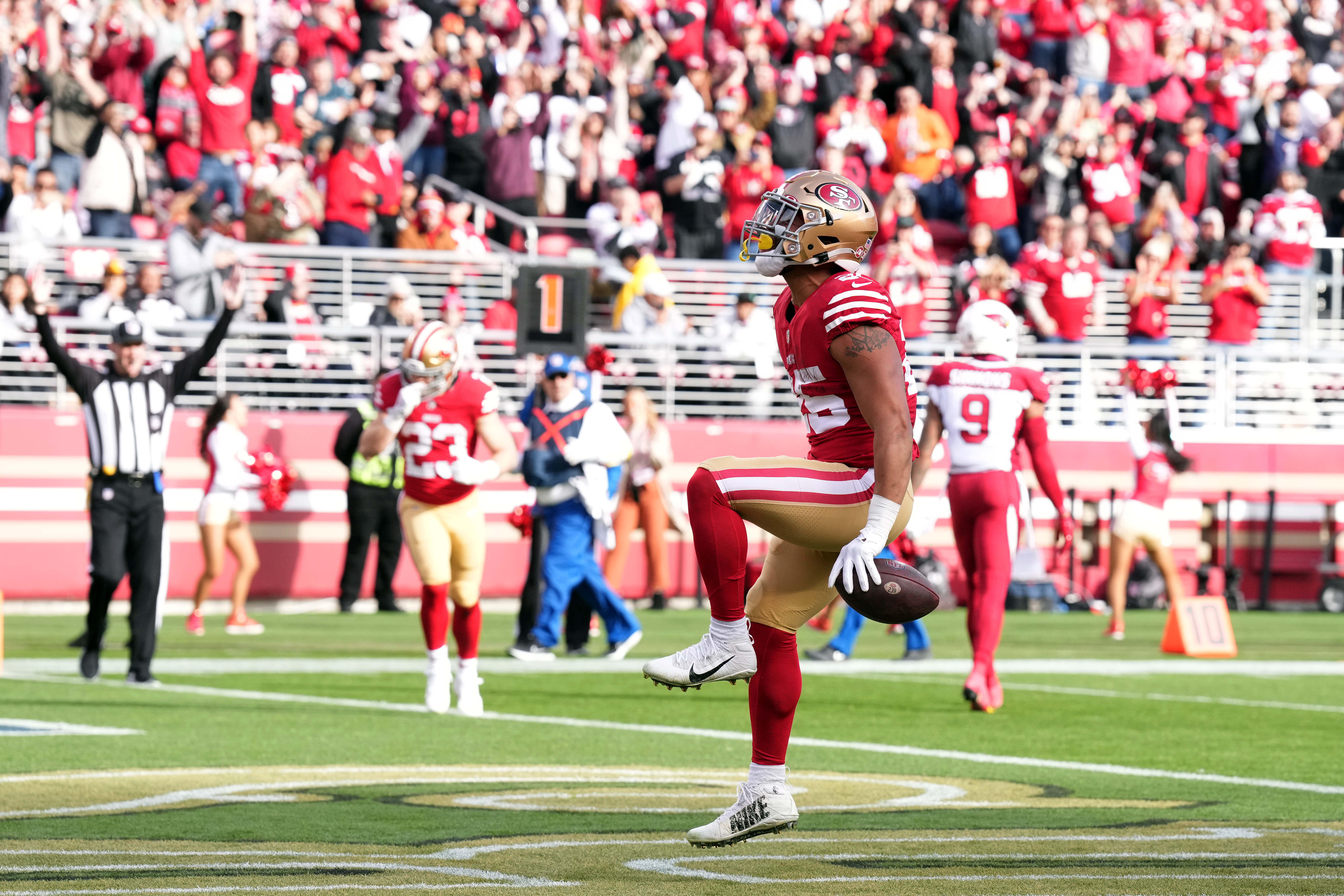 Jan 8, 2023; Santa Clara, California, USA; San Francisco 49ers running back Elijah Mitchell (25) reacts after scoring a touchdown against the Arizona Cardinals during the second quarter at Levi's Stadium. Mandatory Credit: Darren Yamashita-USA TODAY Sports