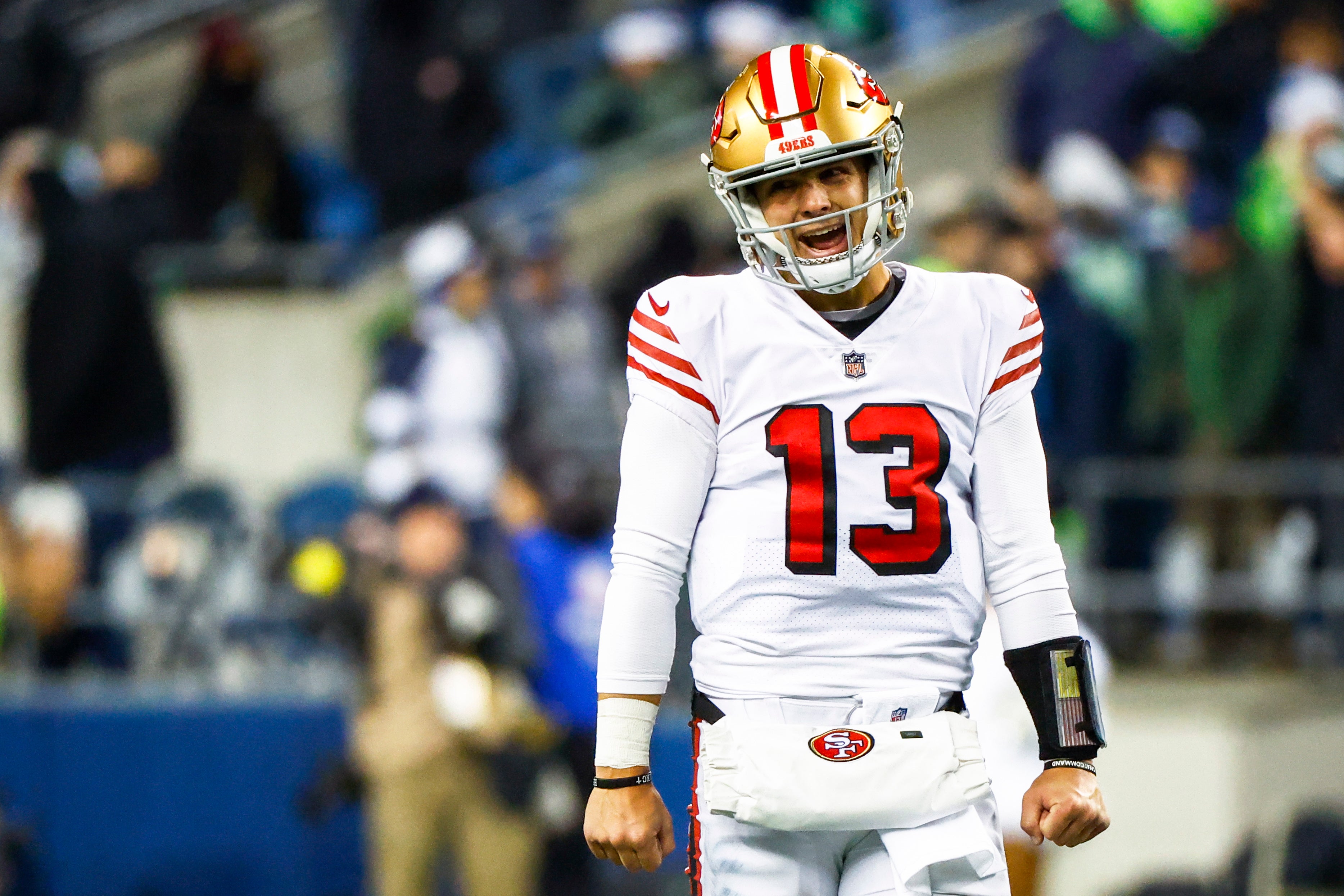 Dec 15, 2022; Seattle, Washington, USA; San Francisco 49ers quarterback Brock Purdy (13) celebrates during the late fourth quarter of a 21-13 victory against the Seattle Seahawks at Lumen Field. Mandatory Credit: Joe Nicholson-USA TODAY Sports