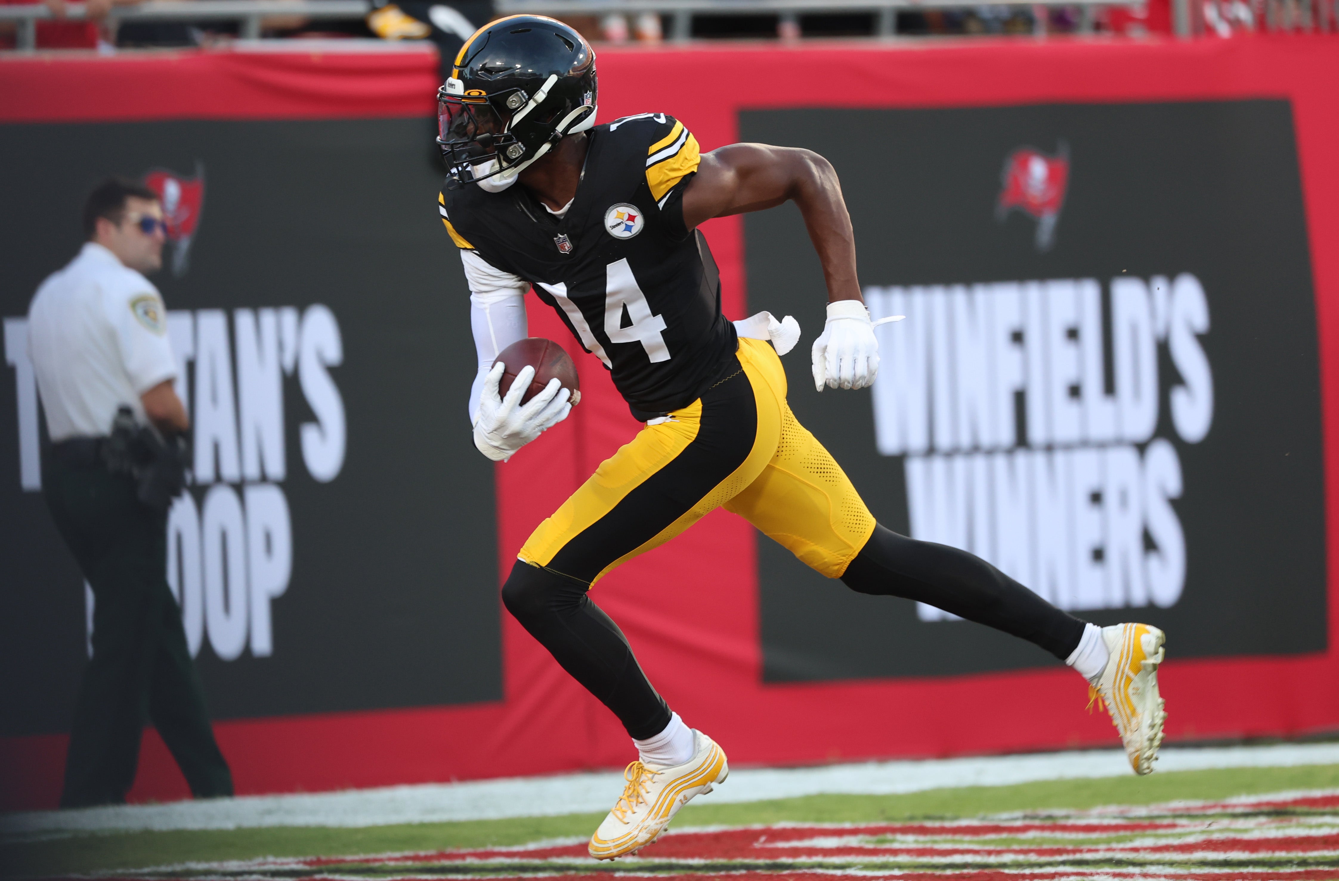 Aug 11, 2023; Tampa, Florida, USA; Pittsburgh Steelers wide receiver George Pickens (14) runs the ball in for a touchdown against the Tampa Bay Buccaneers during the first quarter at Raymond James Stadium. Mandatory Credit: Kim Klement Neitzel-USA TODAY Sports