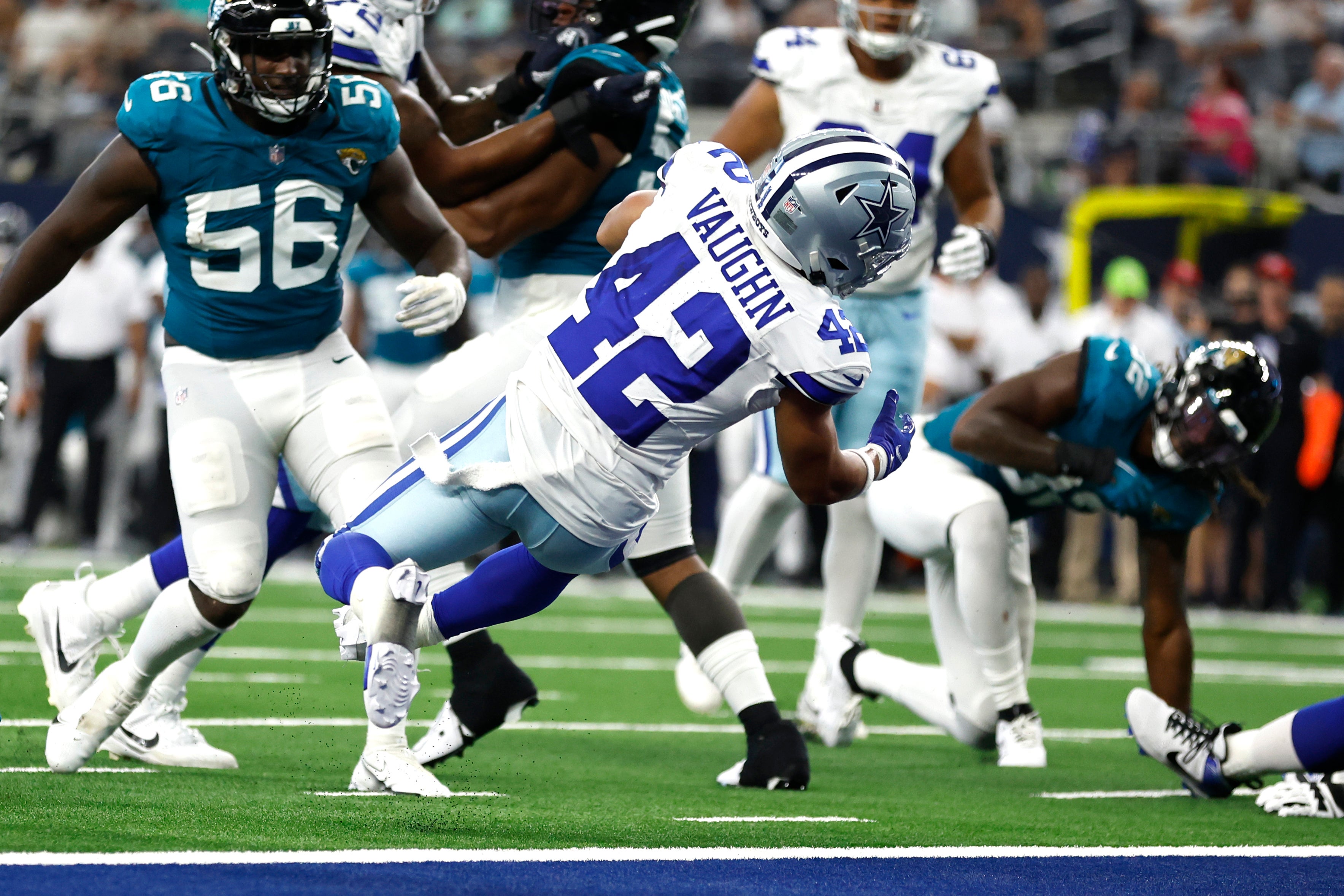 Dallas Cowboys running back Deuce Vaughn (42) scores a touchdown against the Jacksonville Jaguars in the fourth quarter at AT&T Stadium. Mandatory Credit: Tim Heitman-USA TODAY Sports