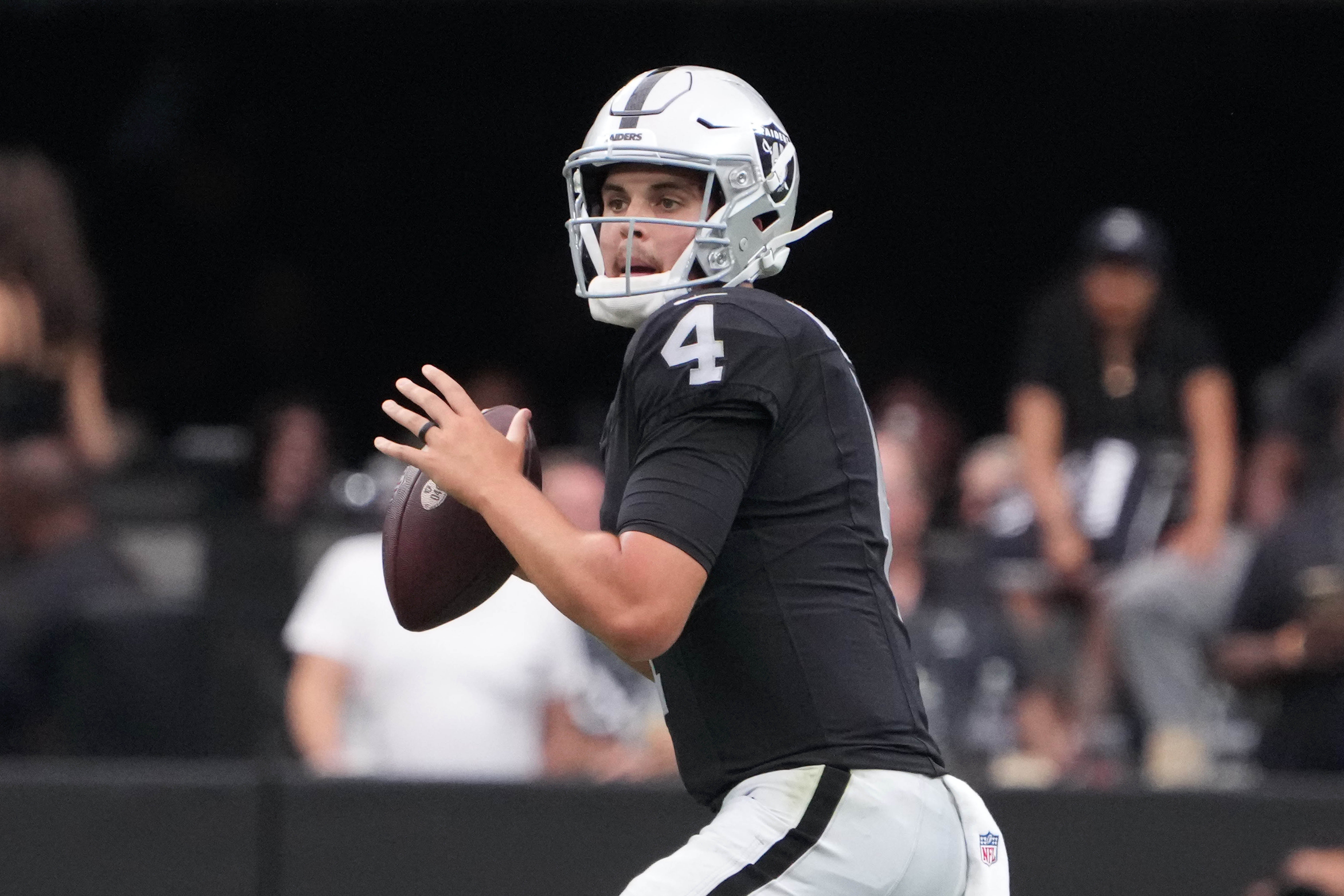 Aug 13, 2023; Paradise, Nevada, USA; Las Vegas Raiders quarterback Aidan O'Connell (4) throws the ball against the San Francisco 49ers] in the first half at Allegiant Stadium. Kirby Lee-USA TODAY Sports