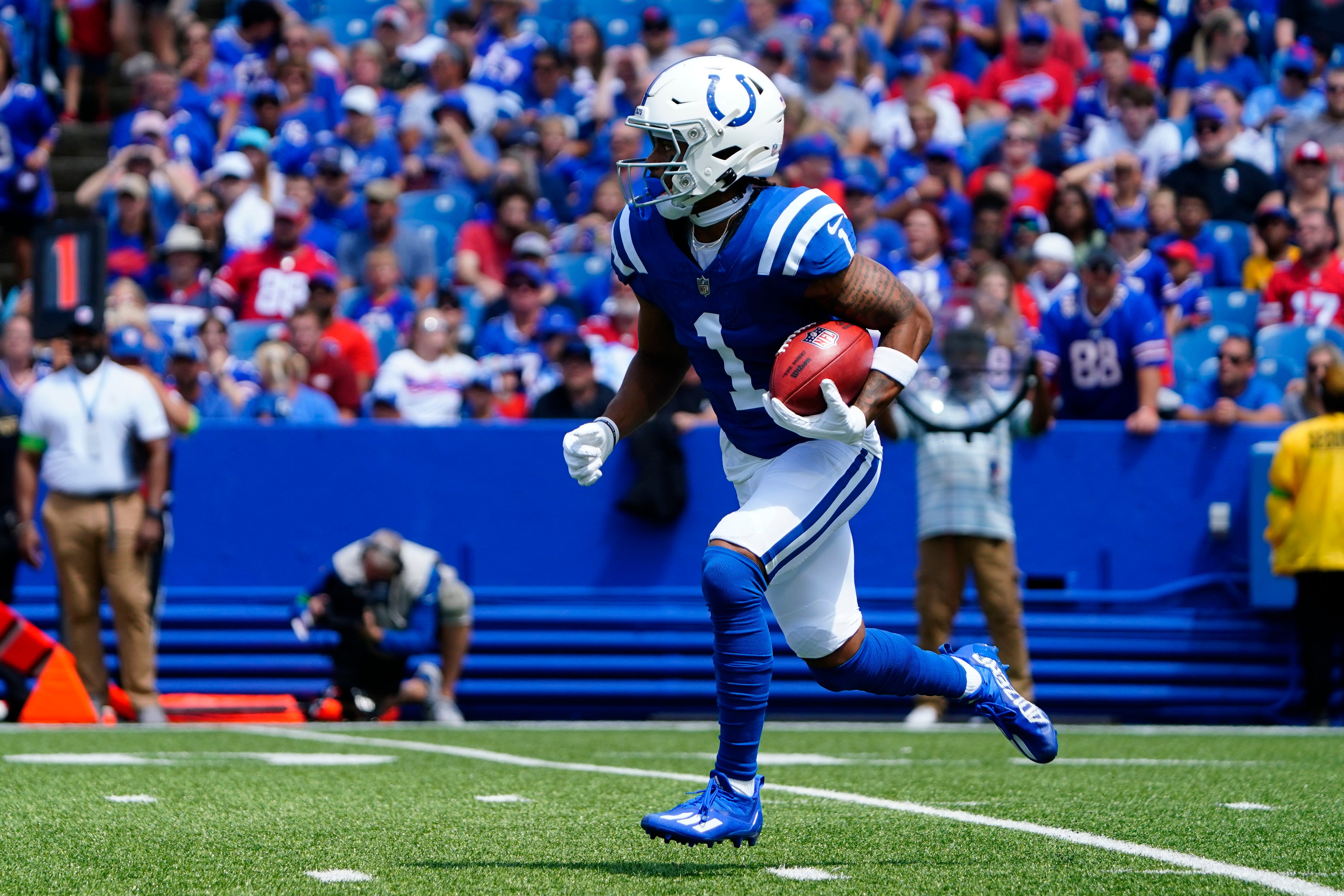 Aug 12, 2023; Orchard Park, New York, USA; Indianapolis Colts wide receiver Josh Downs (1) returns a kick against the Buffalo Bills during the first half at Highmark Stadium.