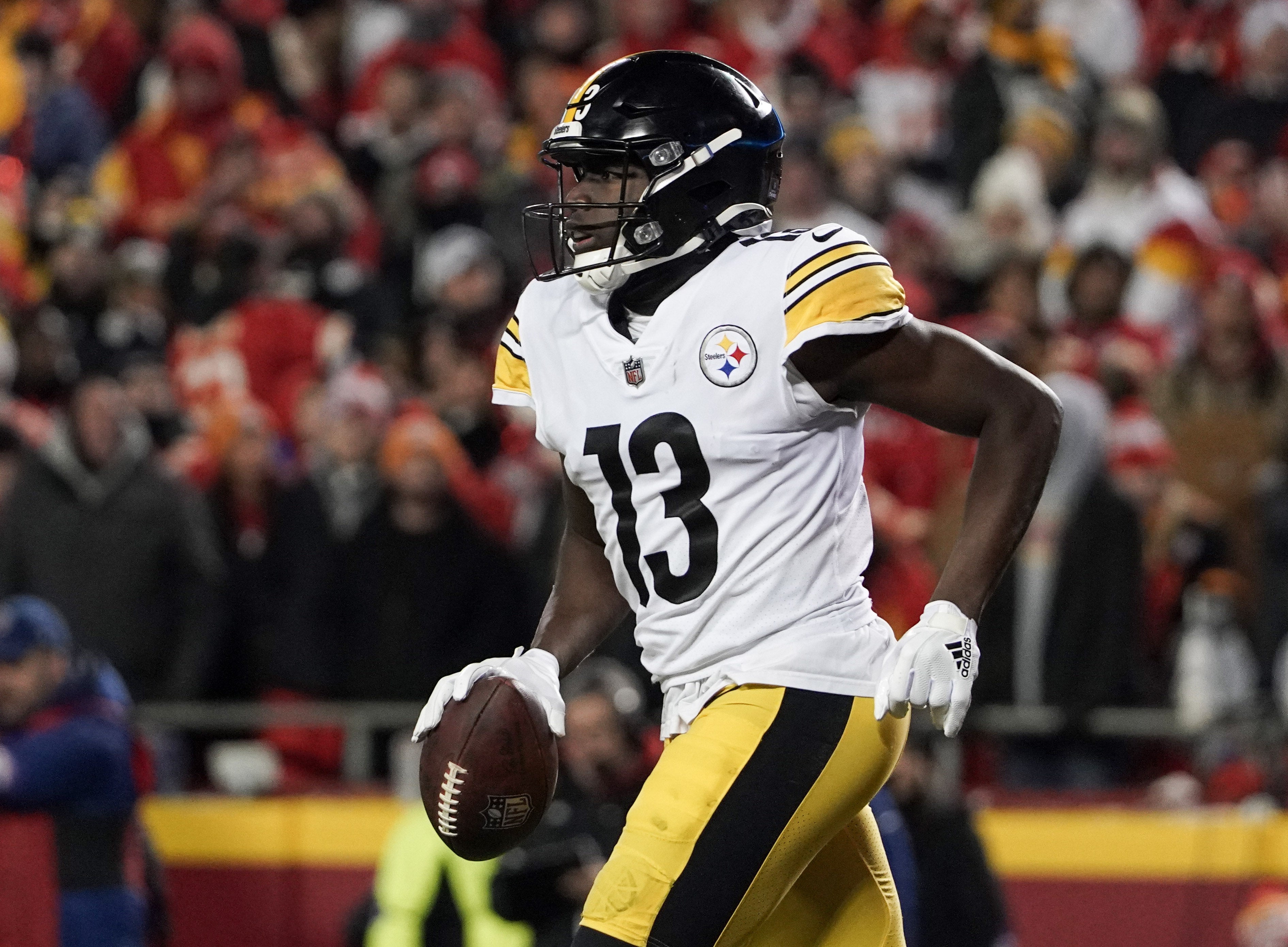 Jan 16, 2022; Kansas City, Missouri, USA; Pittsburgh Steelers wide receiver James Washington (13) returns to the sidelines after scoring against the Kansas City Chiefs in an AFC Wild Card playoff football game at GEHA Field at Arrowhead Stadium.