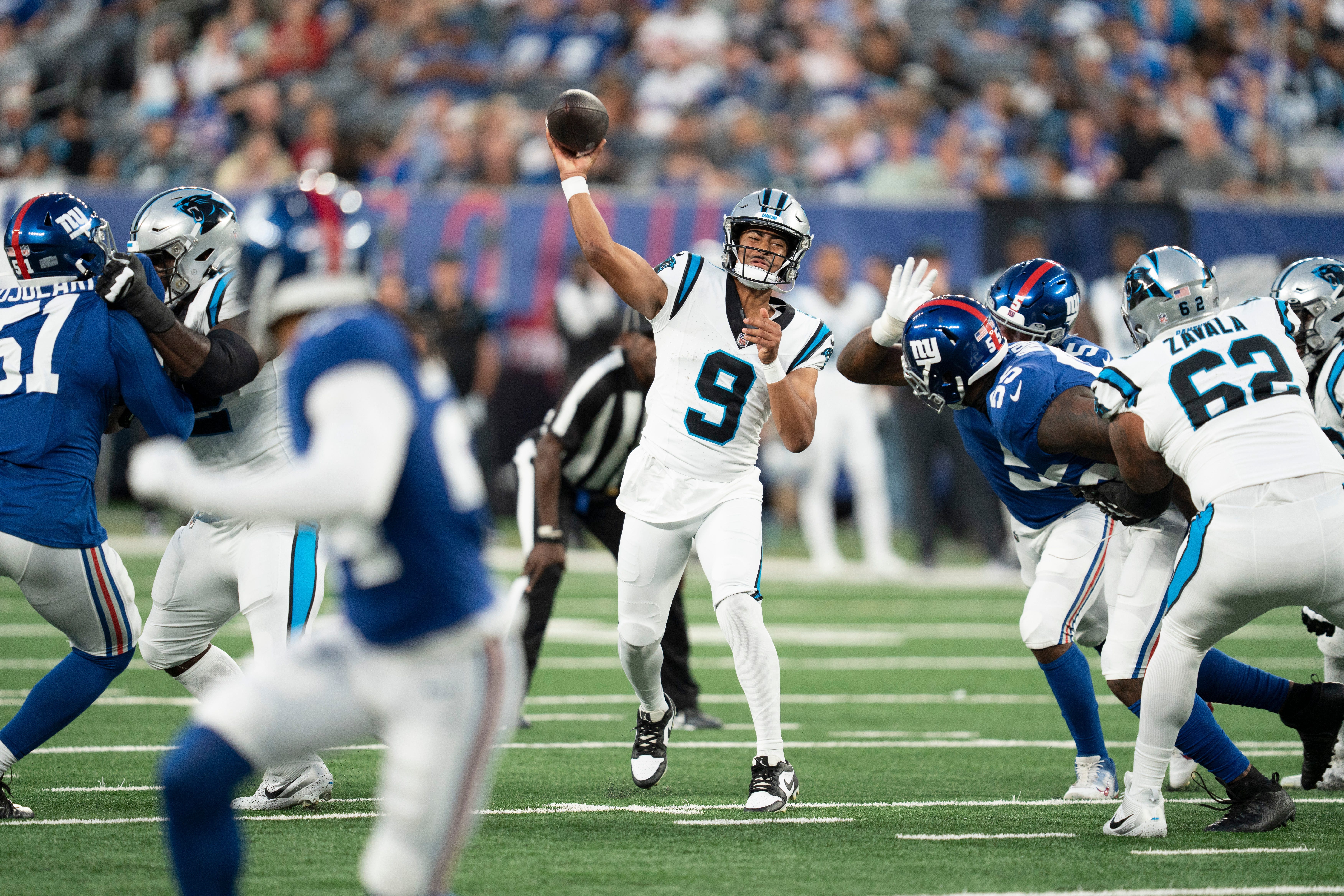 Panthers QB Bryce Young looks to throw during the preseason game against the Giants.