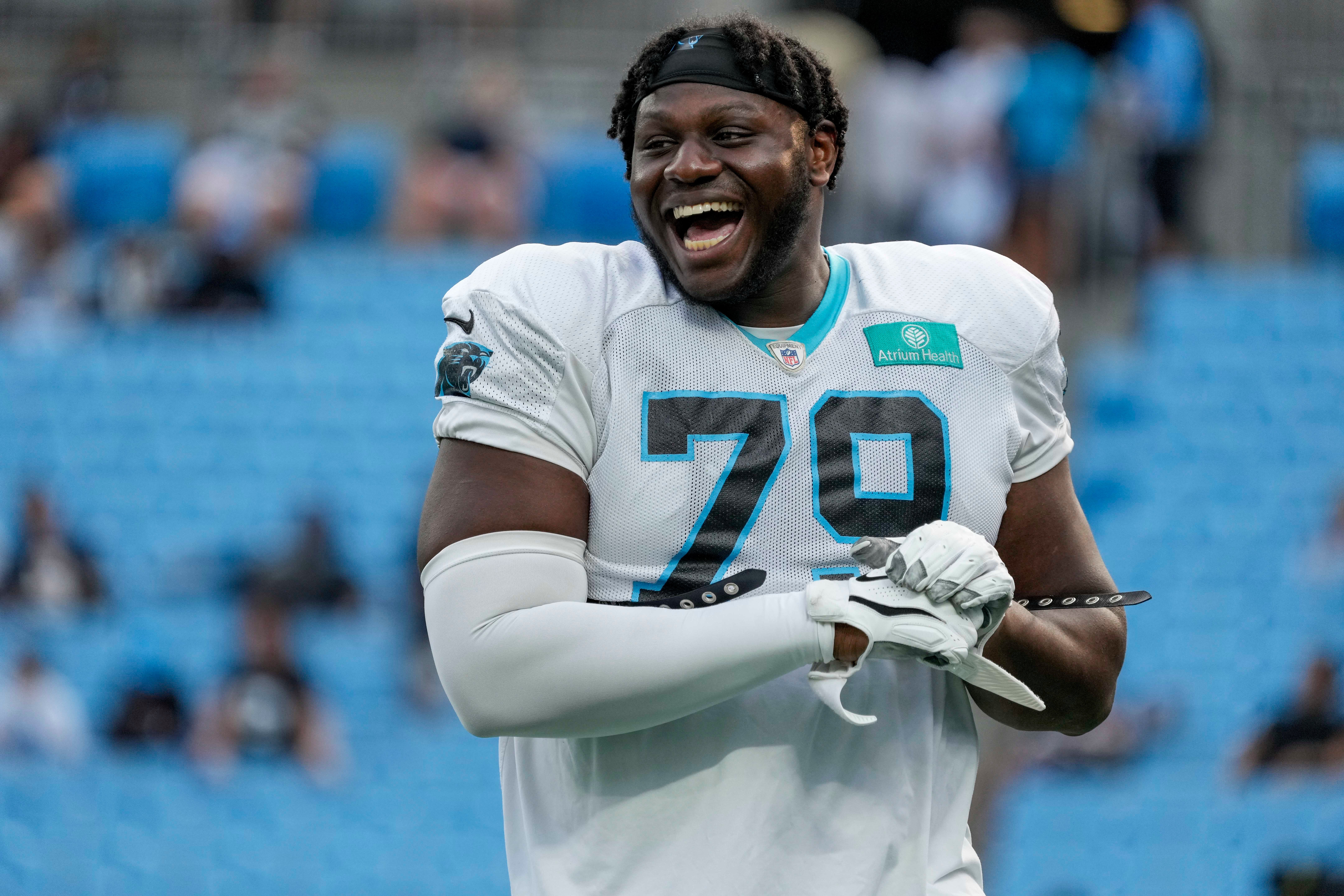 Aug 2, 2023; Charlotte, NC, USA; Carolina Panthers offensive tackle Ikem Ekwonu (79) during shares a laugh at Fan Fest at Bank of America Stadium in Charlotte, NC. Mandatory Credit: Jim Dedmon-USA TODAY Sports