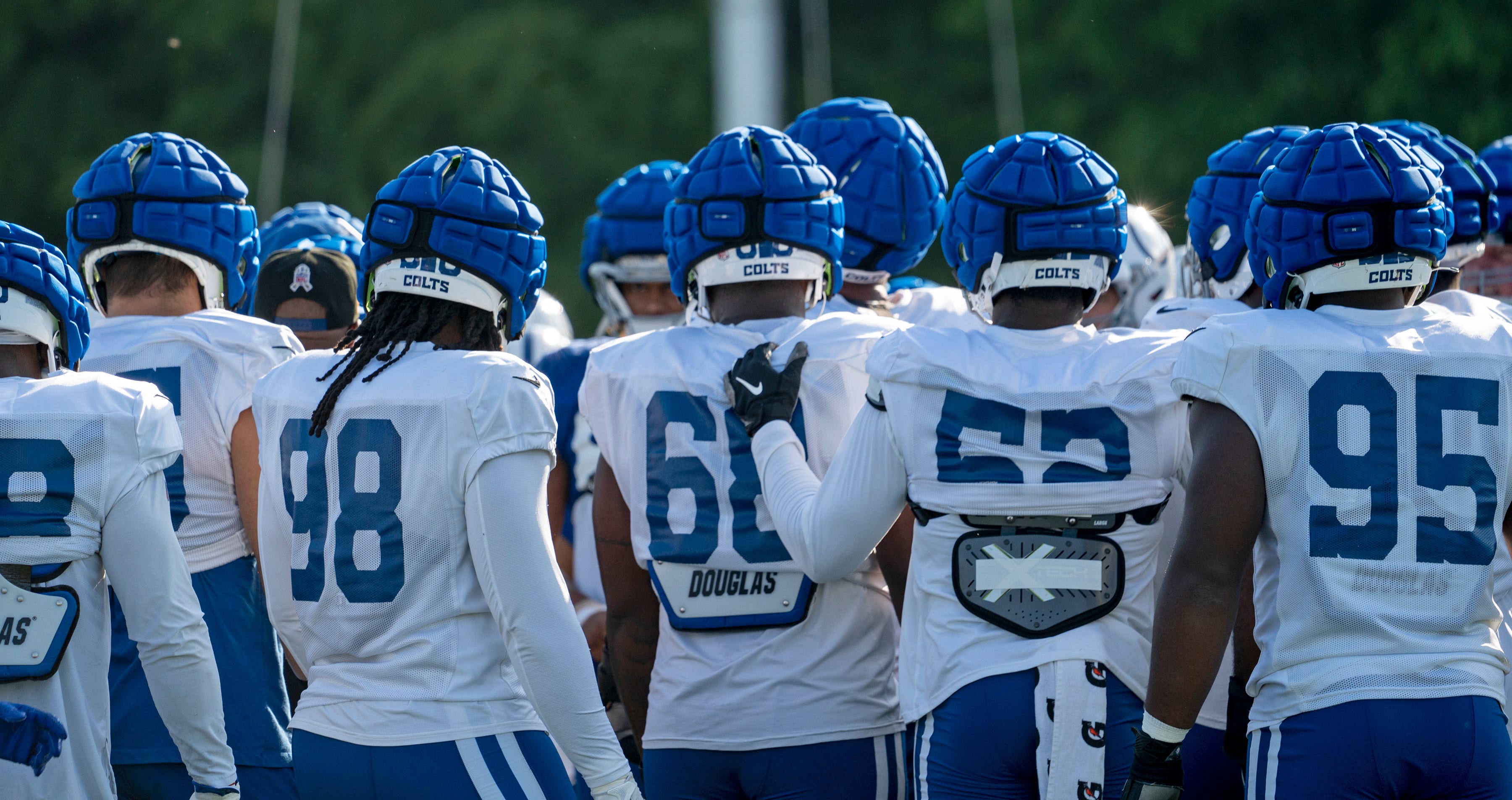 Indianapolis Colts players come together for a huddle before the start of day #9 practice of Colts Camp, Tuesday, Aug. 8, 2023 at Grand Park in Westfield.