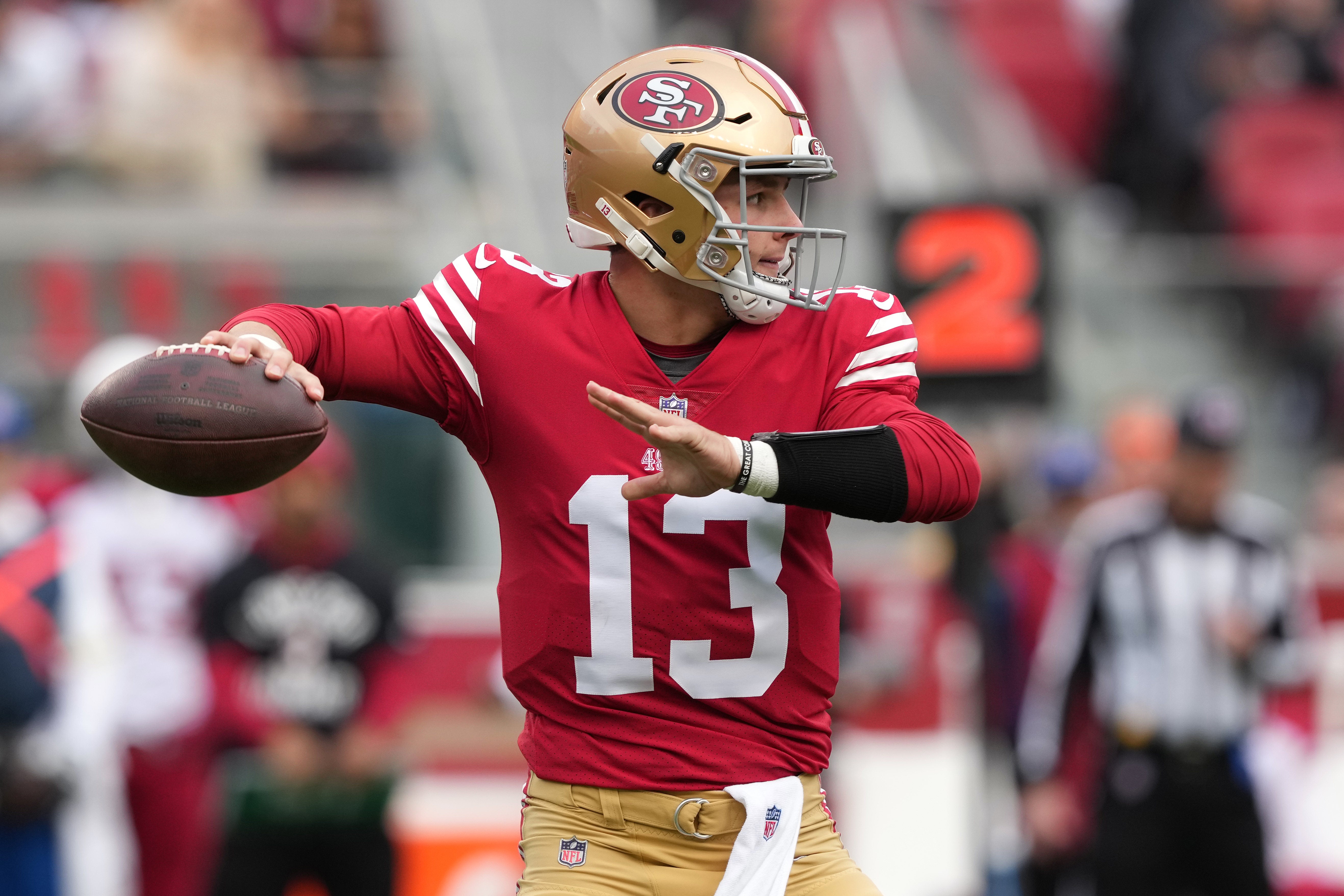 Jan 8, 2023; Santa Clara, California, USA; San Francisco 49ers quarterback Brock Purdy (13) throws a pass against the Arizona Cardinals during the first quarter at Levi's Stadium. Mandatory Credit: Darren Yamashita-USA TODAY Sports