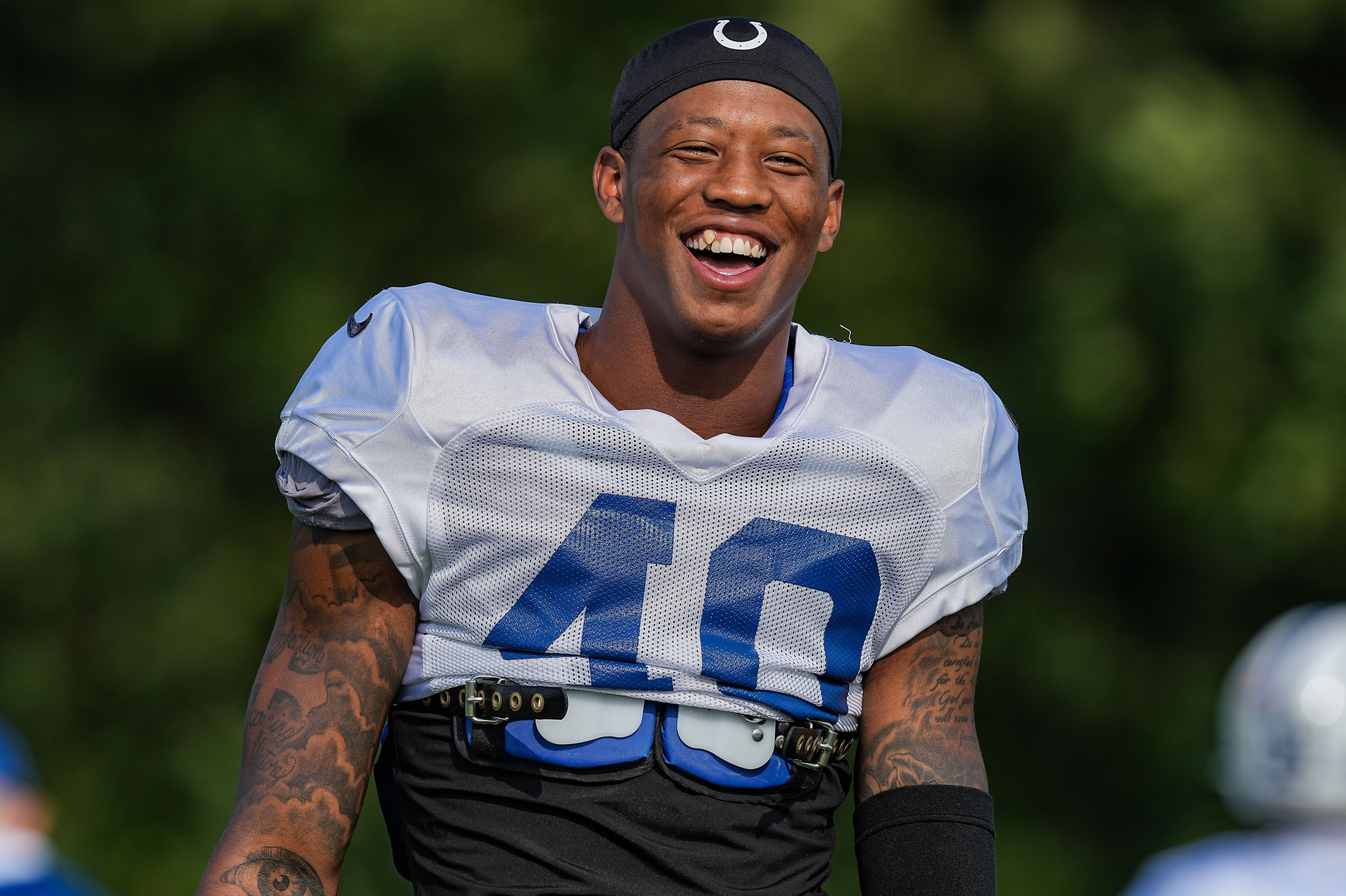 Indianapolis Colts cornerback Jaylon Jones (40) smiles while laughing with another teammate Thursday, Aug. 17, 2023, during training camp at Grand Park Sports Campus in Westfield.