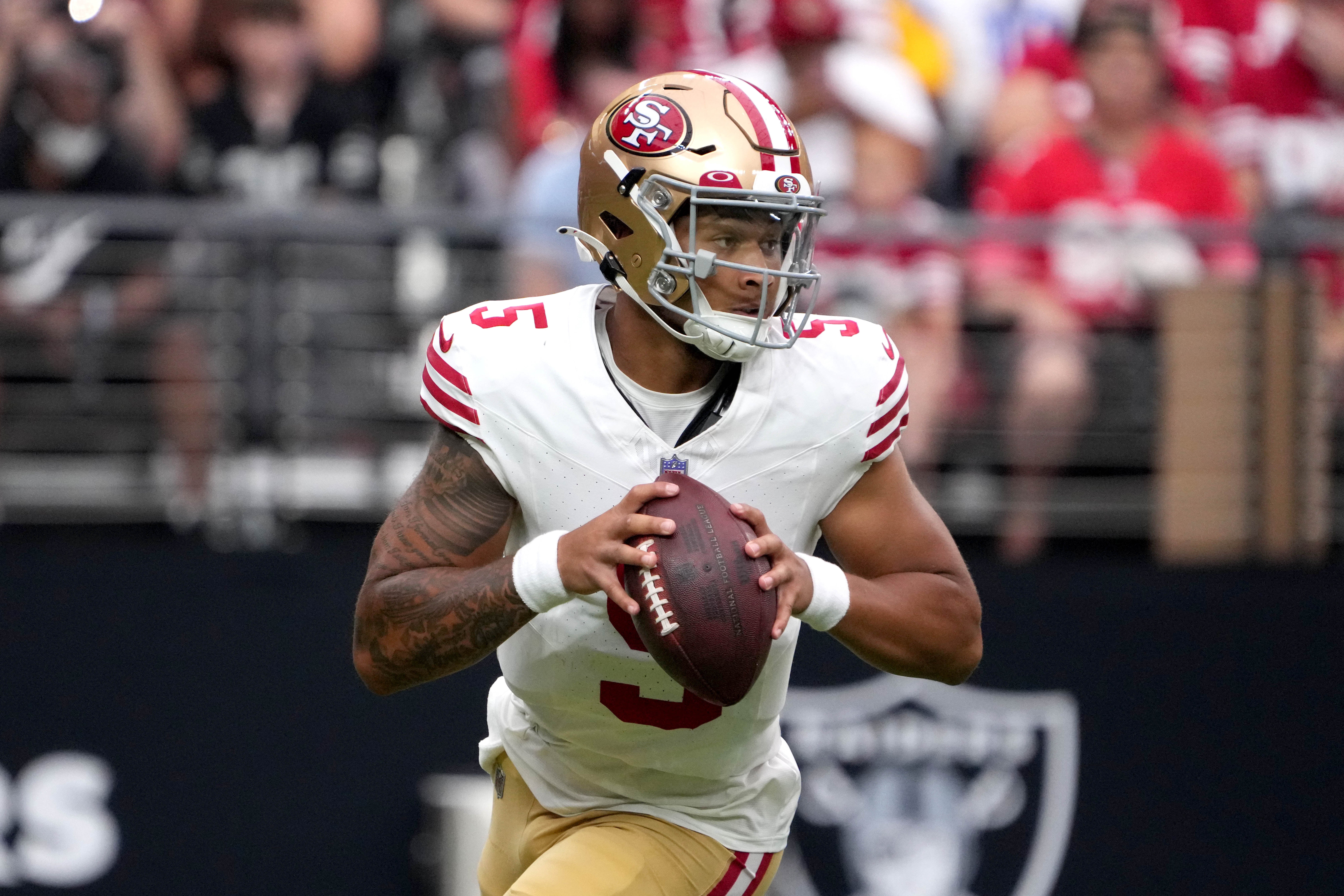 Aug 13, 2023; Paradise, Nevada, USA; San Francisco 49ers quarterback Trey Lance (5) throws the ball against the Las Vegas Raiders at in the first half at Allegiant Stadium. Mandatory Credit: Kirby Lee-USA TODAY Sports