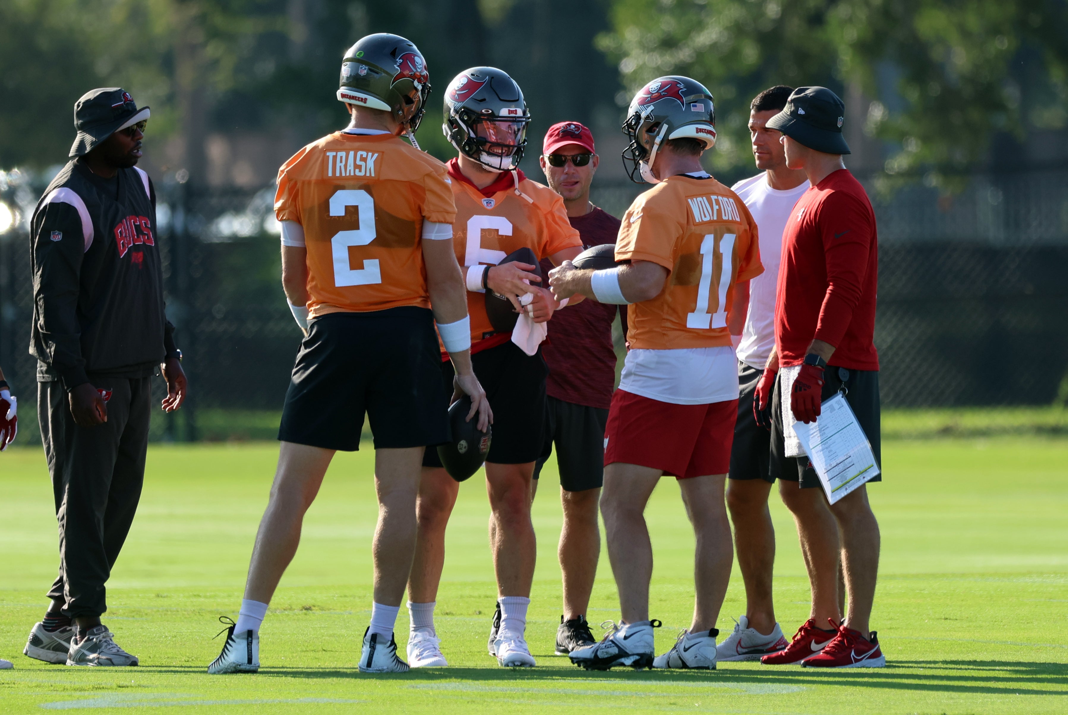 Jul 30, 2023; Tampa, FL, USA; Tampa Bay Buccaneers quarterback Baker Mayfield (6), quarterback John Wolford (11) and quarterback Kyle Trask (2) talk during training camp at AdventHealth Training Center. Mandatory Credit: Kim Klement-USA TODAY Sports