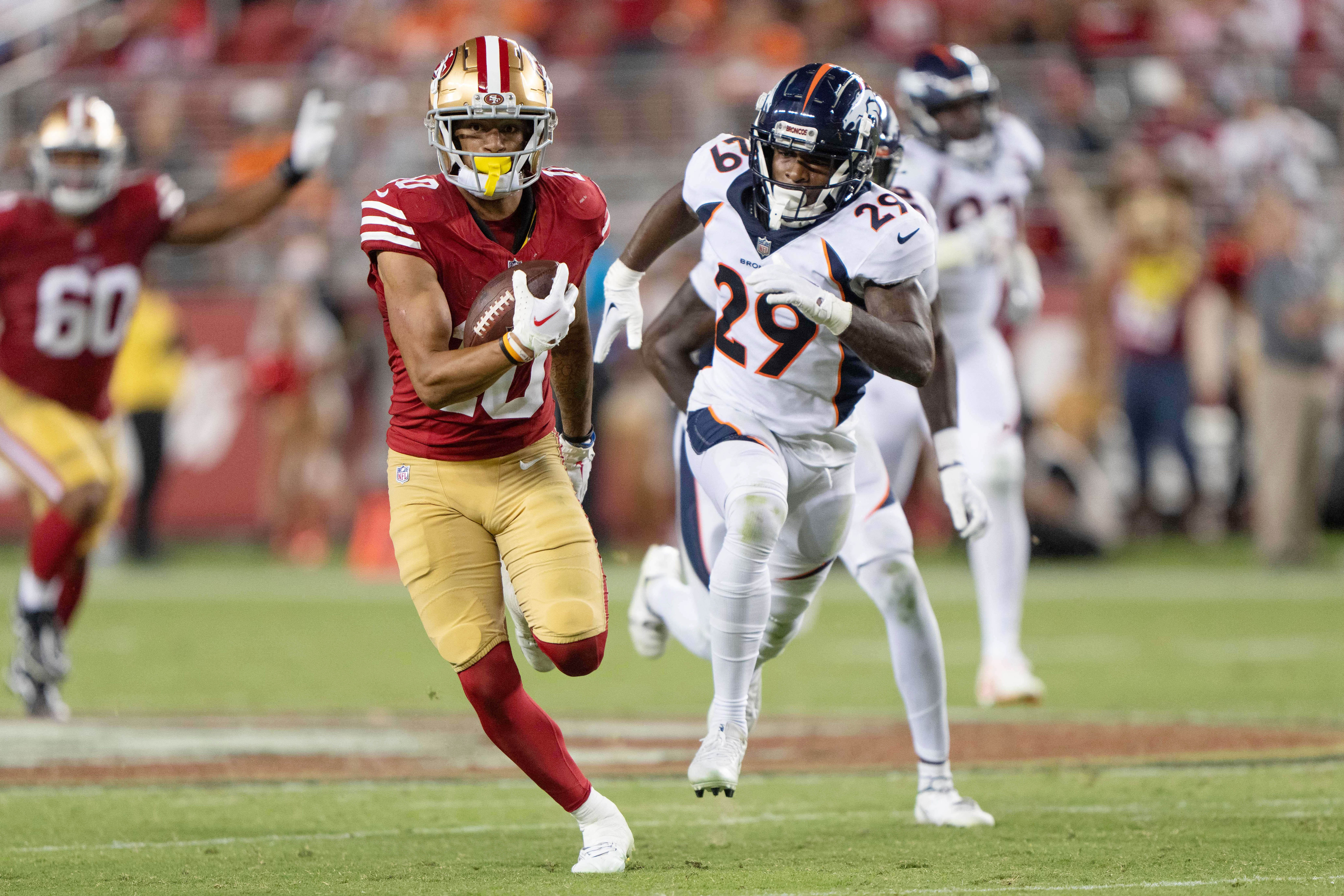Aug 19, 2023; Santa Clara, California, USA; San Francisco 49ers wide receiver Ronnie Bell (10) runs with the football during the fourth quarter against Denver Broncos cornerback Faion Hicks (29) at Levi's Stadium. Mandatory Credit: Stan Szeto-USA TODAY Sports