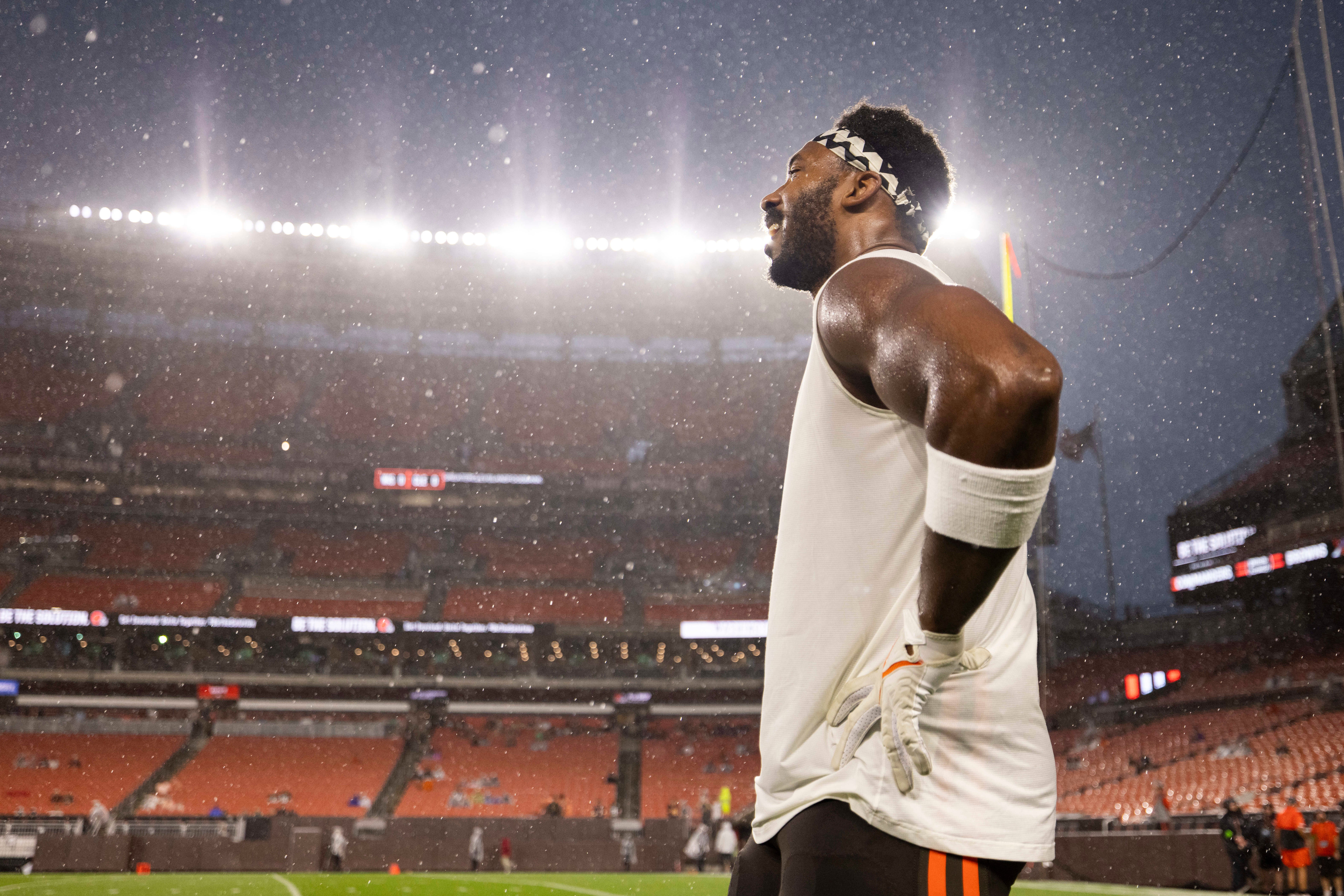 Aug 11, 2023; Cleveland, Ohio, USA; Cleveland Browns defensive end Myles Garrett (95) stands in the rain before the game against the Washington Commanders which was delayed due to severe weather at Cleveland Browns Stadium. Mandatory Credit: Scott Galvin-USA TODAY Sports