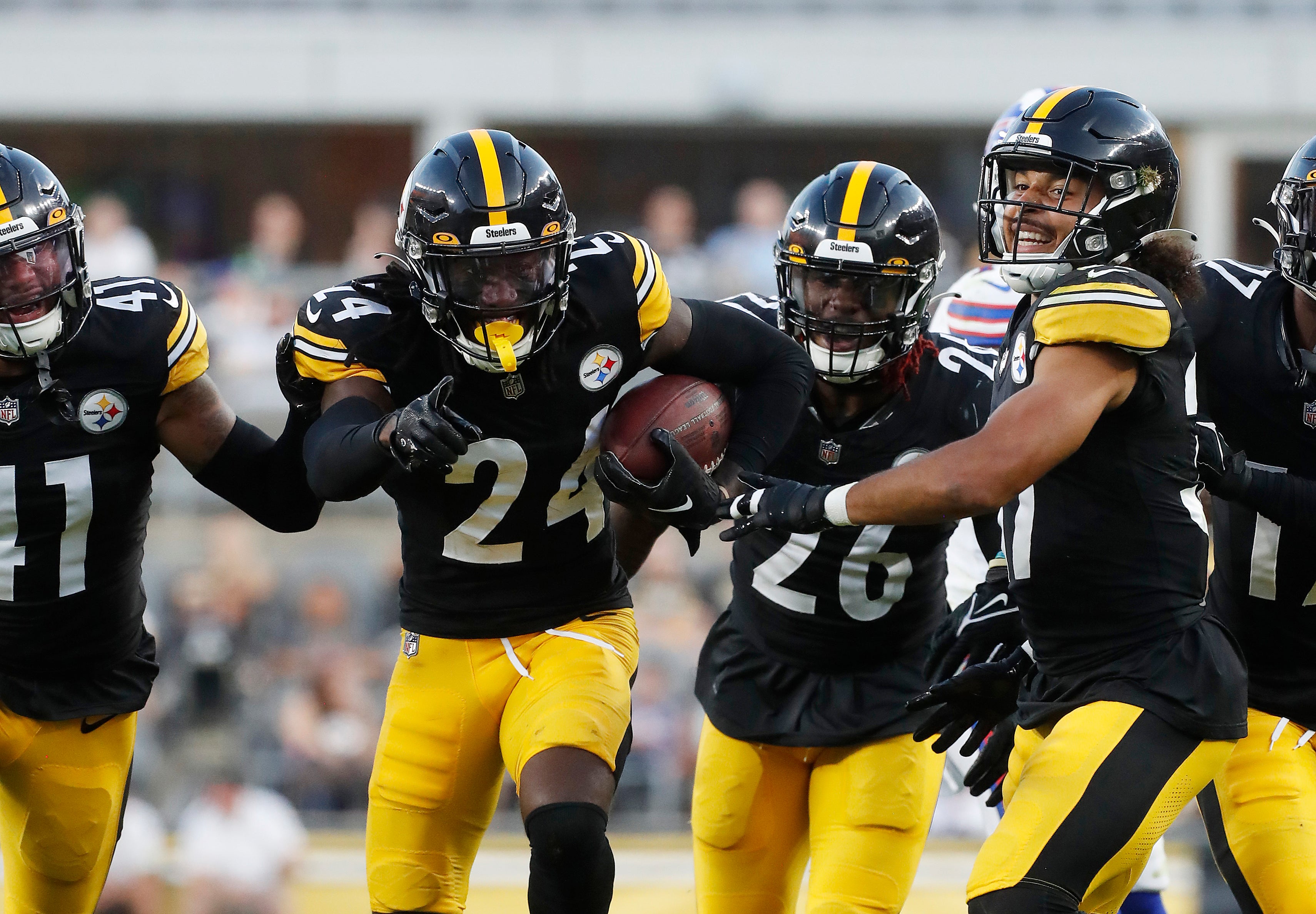 Aug 19, 2023; Pittsburgh, Pennsylvania, USA; Pittsburgh Steelers cornerback Joey Porter Jr. (24) reacts with teammates after Porter intercepted a Buffalo Bills pass during the second quarter at Acrisure Stadium. Mandatory Credit: Charles LeClaire-USA TODAY Sports