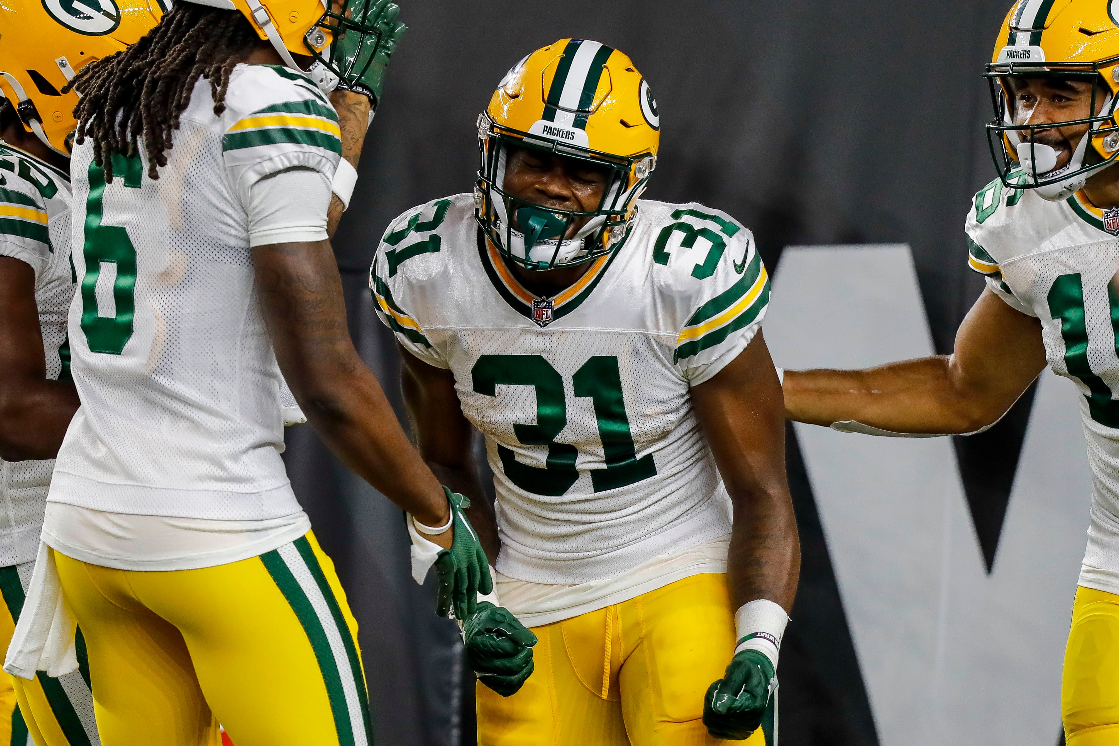 Aug 11, 2023; Cincinnati, Ohio, USA; Green Bay Packers running back Emanuel Wilson (31) reacts after scoring a touchdown against the Cincinnati Bengals in the second half at Paycor Stadium. Katie Stratman-USA TODAY Sports