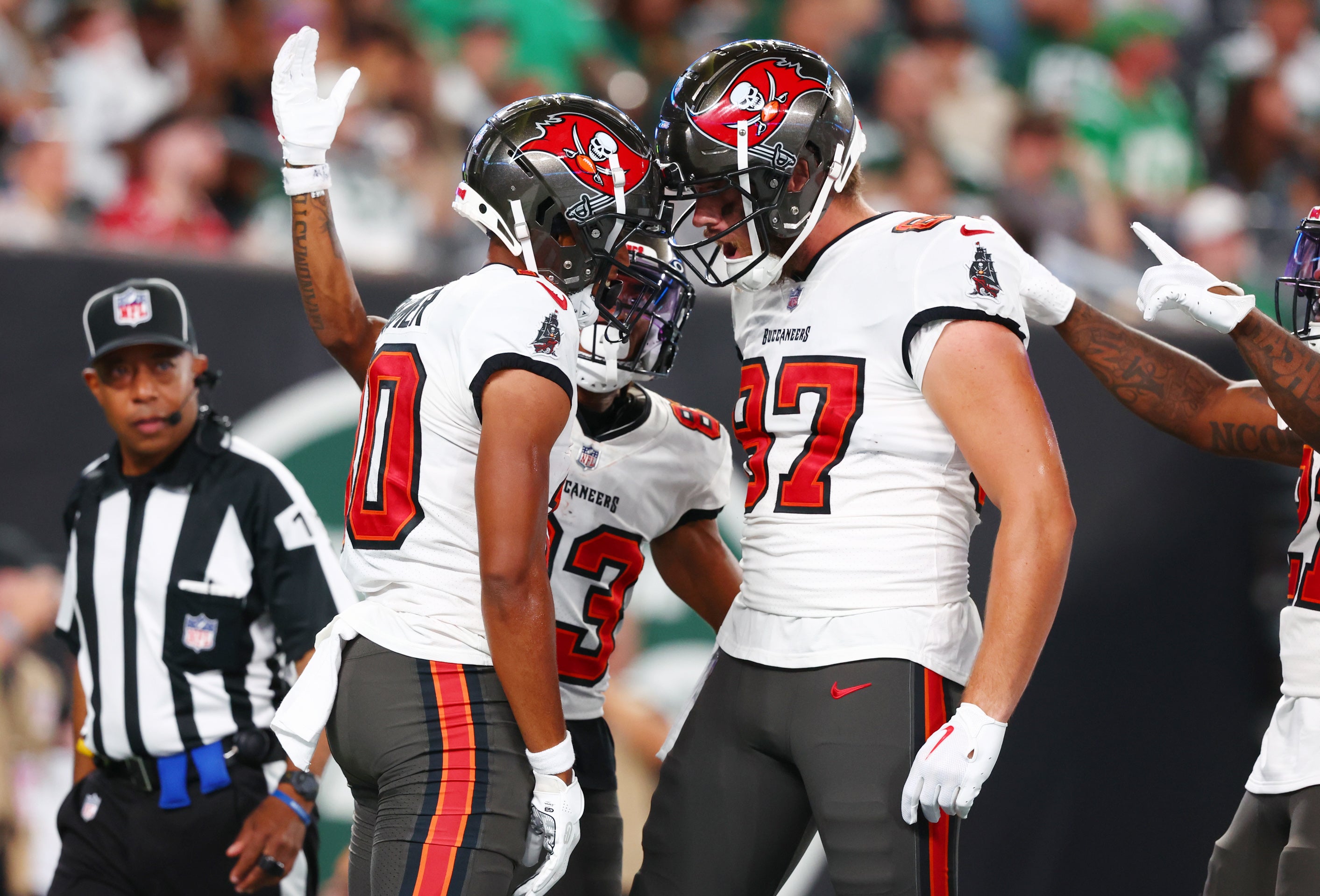 Aug 19, 2023; East Rutherford, New Jersey, USA; Tampa Bay Buccaneers wide receiver Trey Palmer (10) celebrates his touchdown against the New York Jets during the first half at MetLife Stadium. Mandatory Credit: Ed Mulholland-USA TODAY Sports
