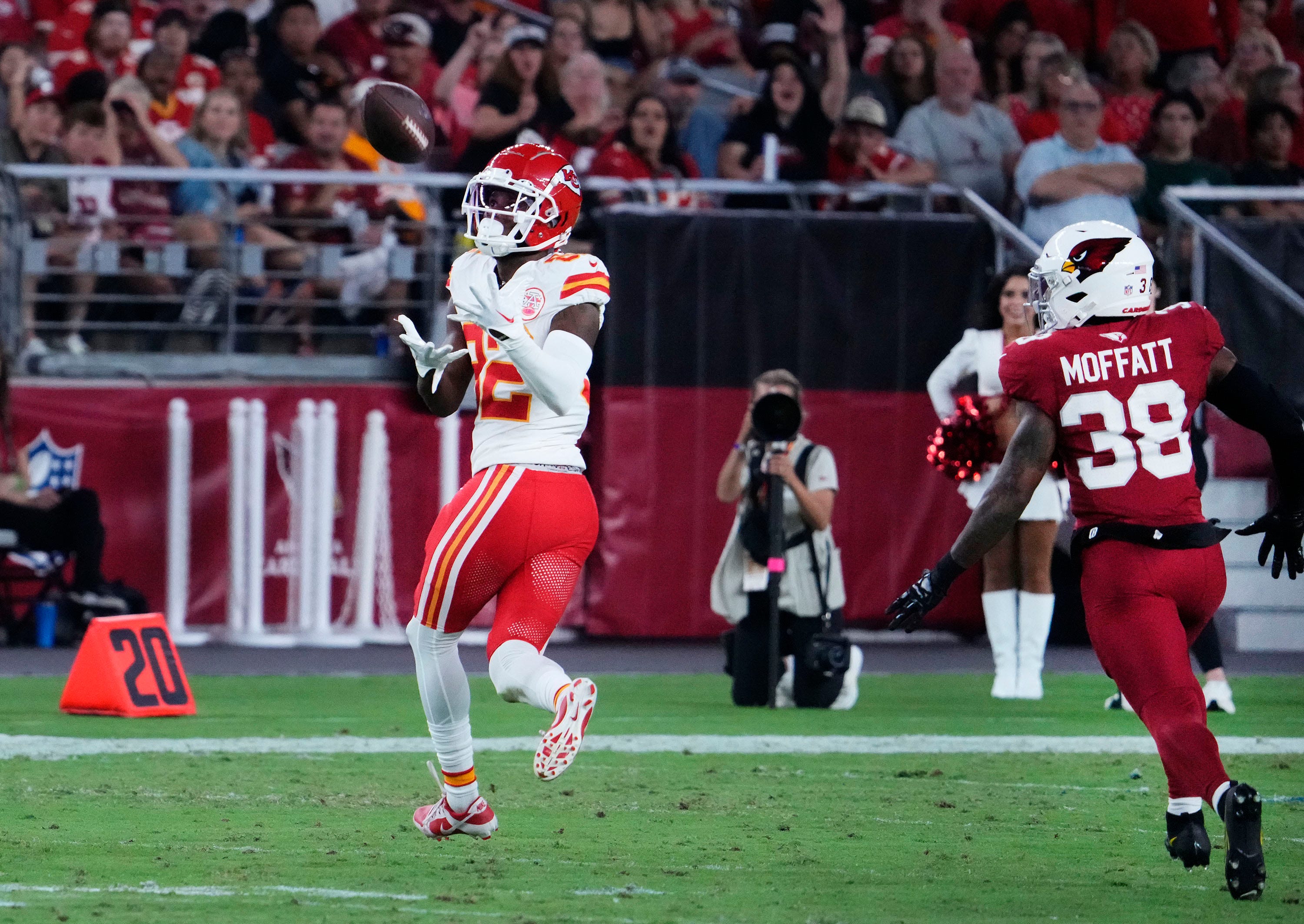 Aug 19, 2023; Glendale, AZ, USA; Kansas City Chiefs wide receiver Ihmir Smith-Marsette (82) catches a pass against Arizona Cardinals safety Jovante Moffatt (38) in the second half during a preseason game at State Farm Stadium. Mandatory Credit: Rob Schumacher-Arizona Republic