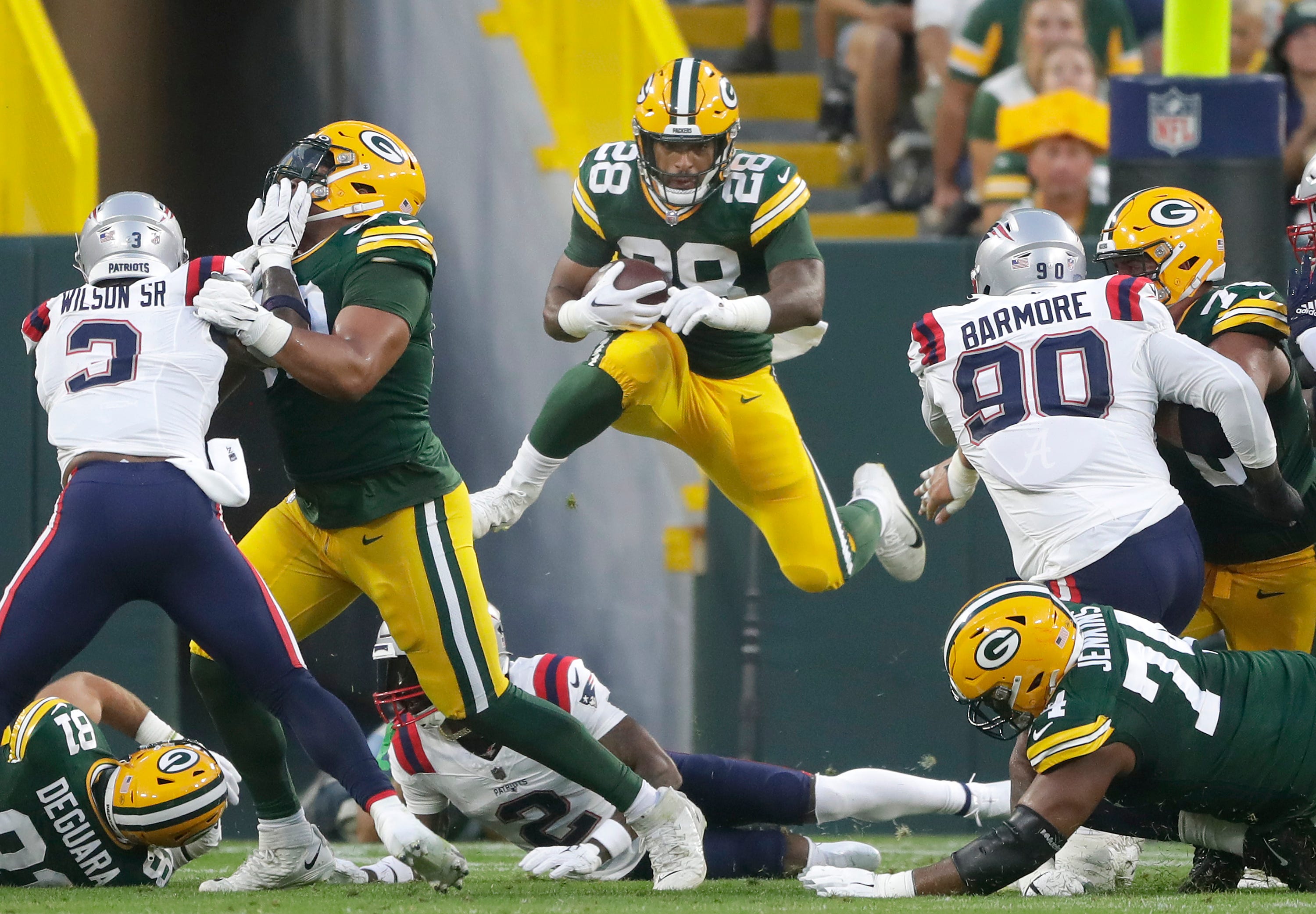 Green Bay Packers running back AJ Dillon (28) rushes in the first quarter against the New England Patriots during their preseason football game Saturday, August 19, 2023, at Lambeau Field in Green Bay, Wis. Wm. Glasheen USA TODAY NETWORK-Wisconsin