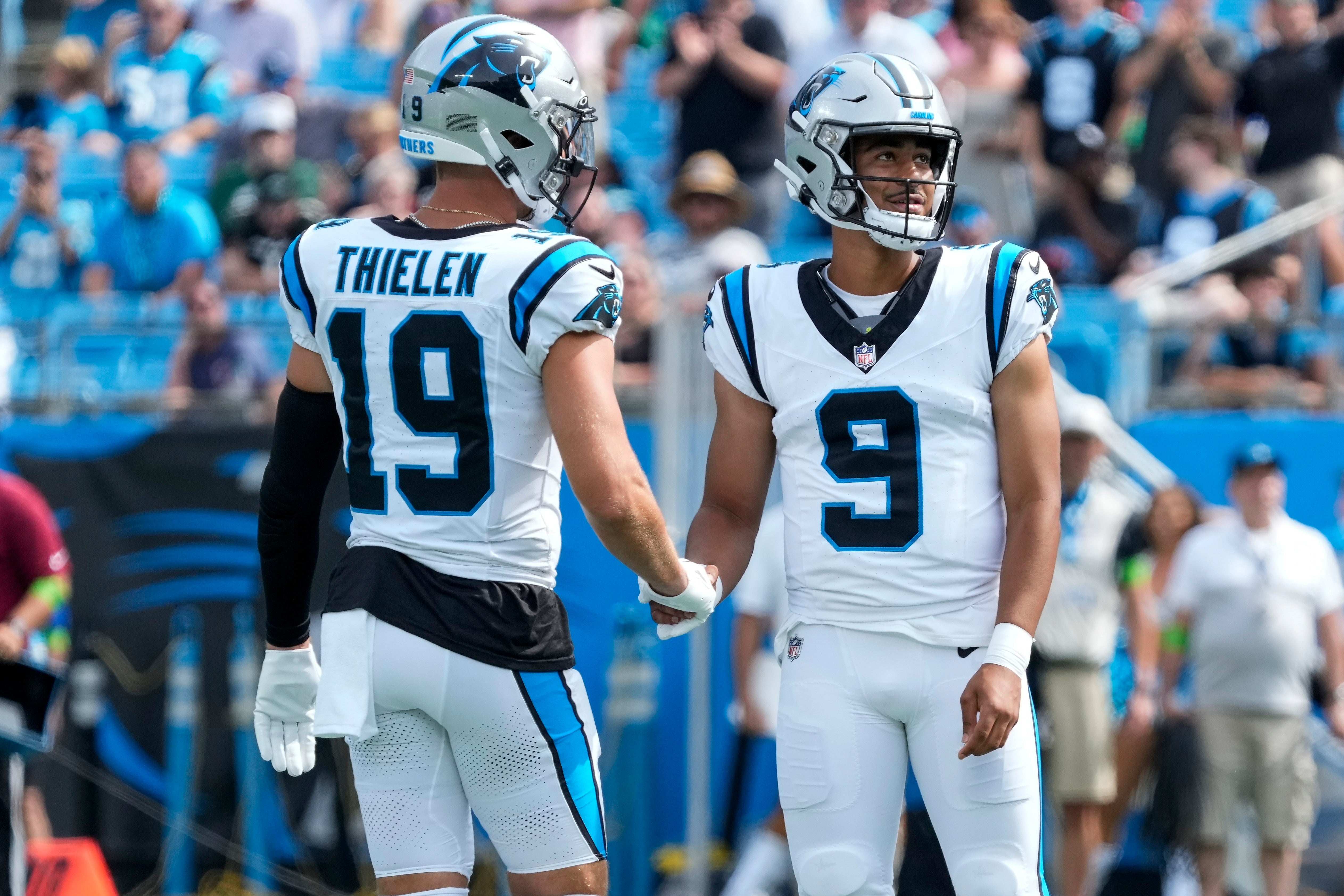 Aug 12, 2023; Charlotte, North Carolina, USA; Carolina Panthers wide receiver Adam Thielen (19) shakes hands with quarterback Bryce Young (9) during the first quarter against the New York Jets at Bank of America Stadium. Mandatory Credit: Jim Dedmon-USA TODAY Sports
