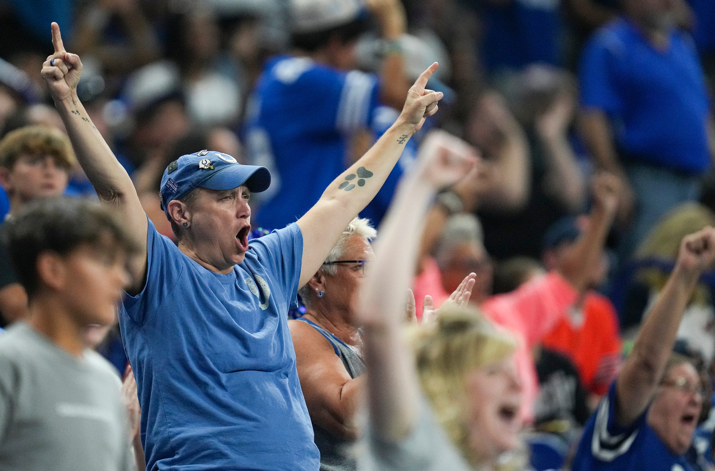 Fans celebrate as the Colts take the lead during the second half of an NFL preseason game Saturday, Aug. 19, 2023, at Lucas Oil Stadium in Indianapolis. The Colts defeated the Bears, 24-17.