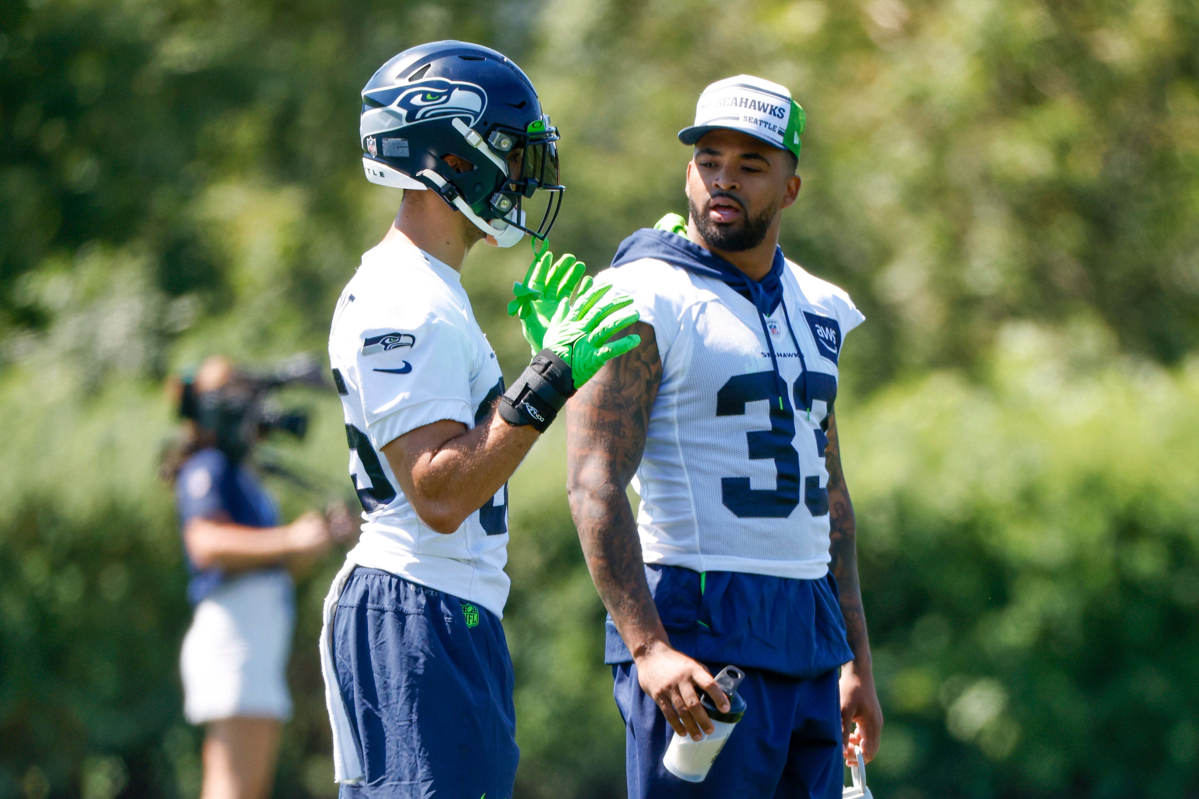 Jul 28, 2023; Renton, WA, USA; Seattle Seahawks safety Jamal Adams (33) talks with safety Joey Blount (35) during training camp practice at the Virginia Mason Athletic Center. Mandatory Credit: Joe Nicholson-USA TODAY Sports