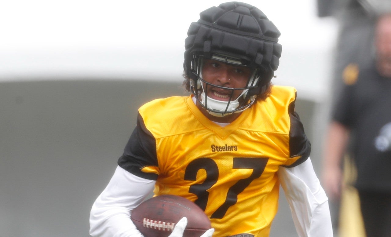 Jul 27, 2023; Latrobe, PA, USA; Pittsburgh Steelers safety Elijah Riley (37) returns an interception in drills during training camp at Saint Vincent College. Mandatory Credit: Charles LeClaire-USA TODAY Sports  