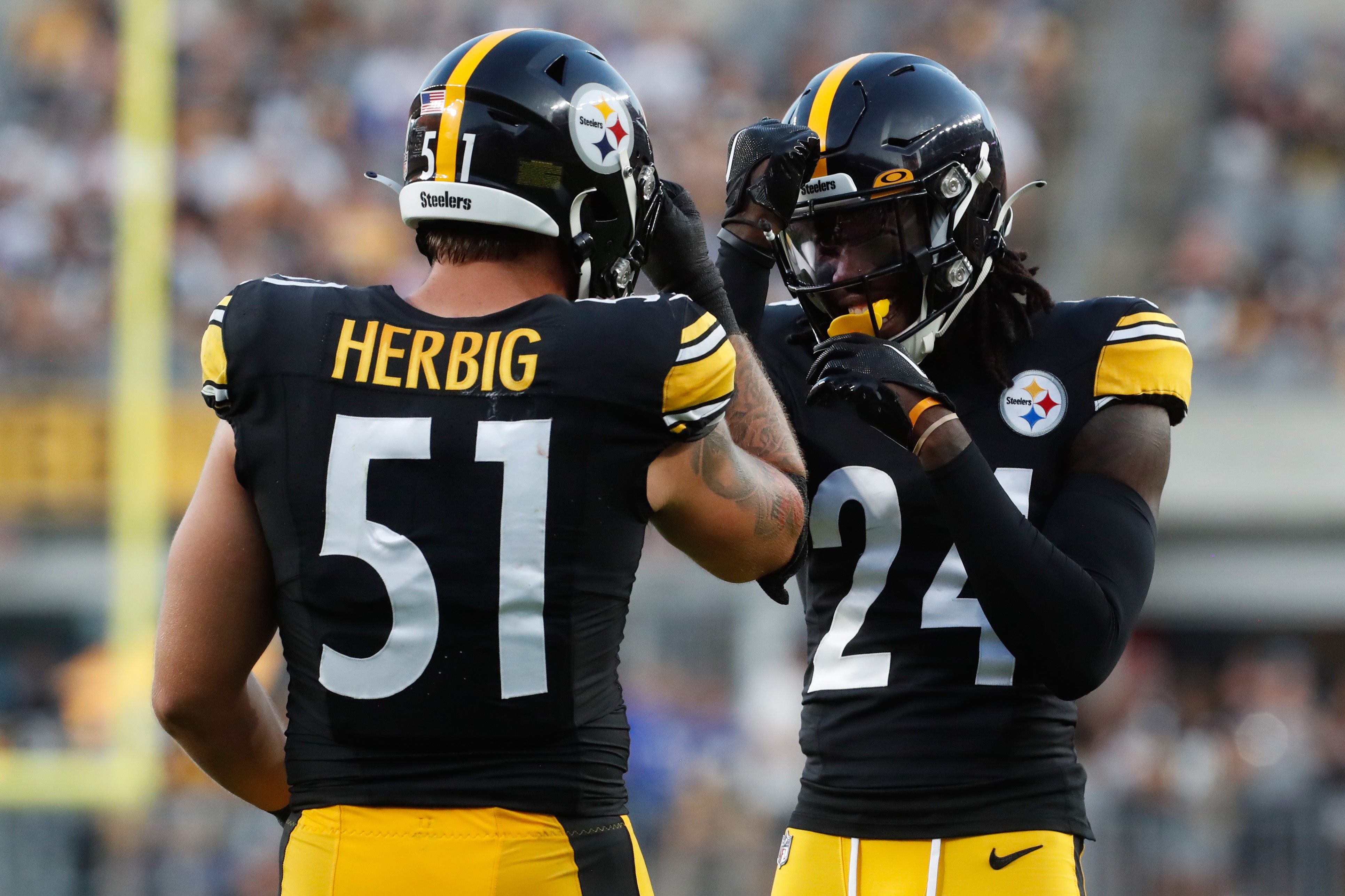 Aug 19, 2023; Pittsburgh, Pennsylvania, USA; Pittsburgh Steelers linebacker Nick Herbig (51) and cornerback Joey Porter Jr. (24) celebrate a defensive stop against the Buffalo Bills during the second quarter at Acrisure Stadium. Mandatory Credit: Charles LeClaire-USA TODAY Sports