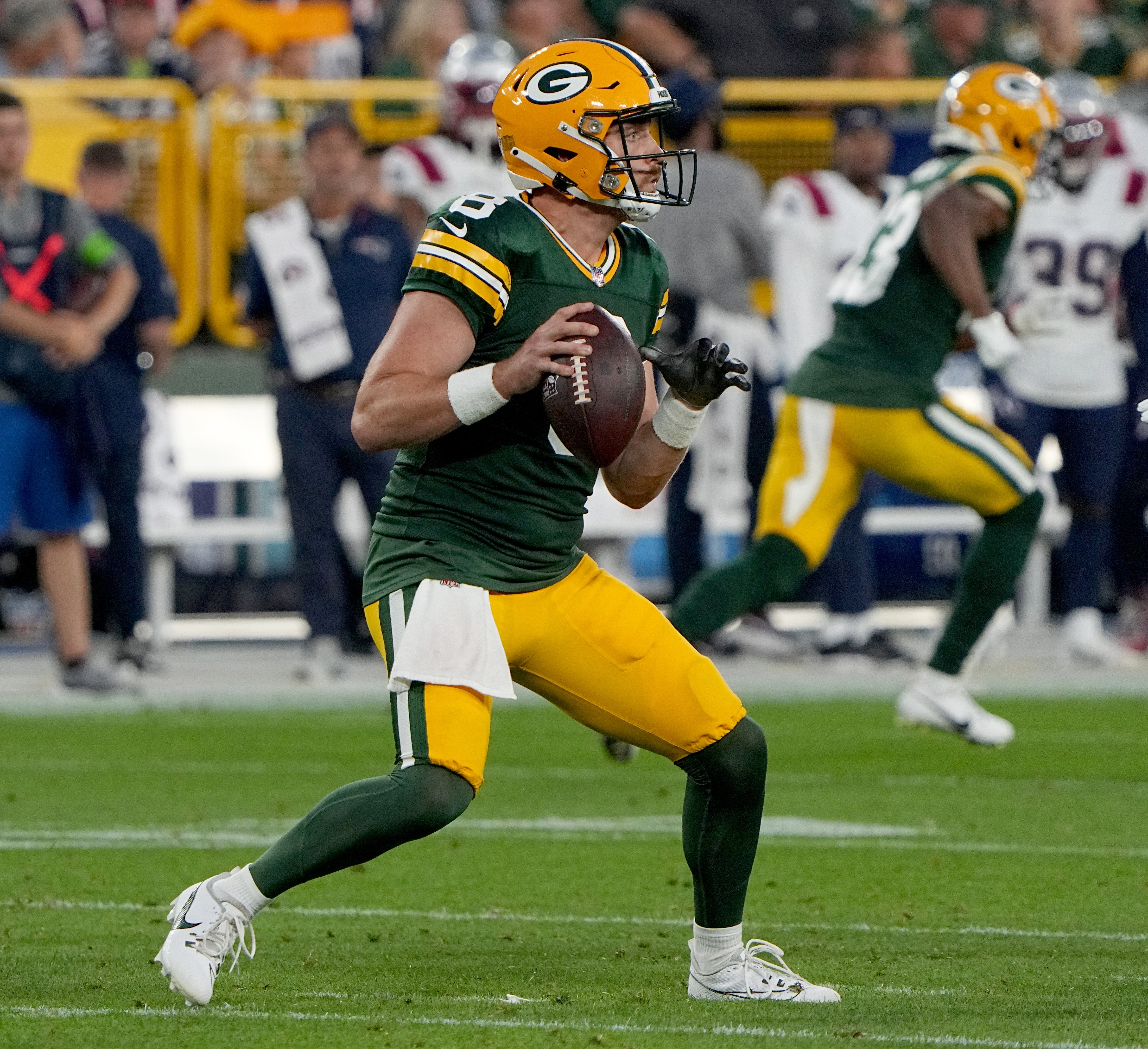 Aug 19, 2023; Green Bay, WI, USA; Green Bay Packers quarterback Sean Clifford (8) looks for an open receiver during the second quarter of their preseason game against the New England Patriots at Lambeau Field. Mark Hoffman-USA TODAY Sports